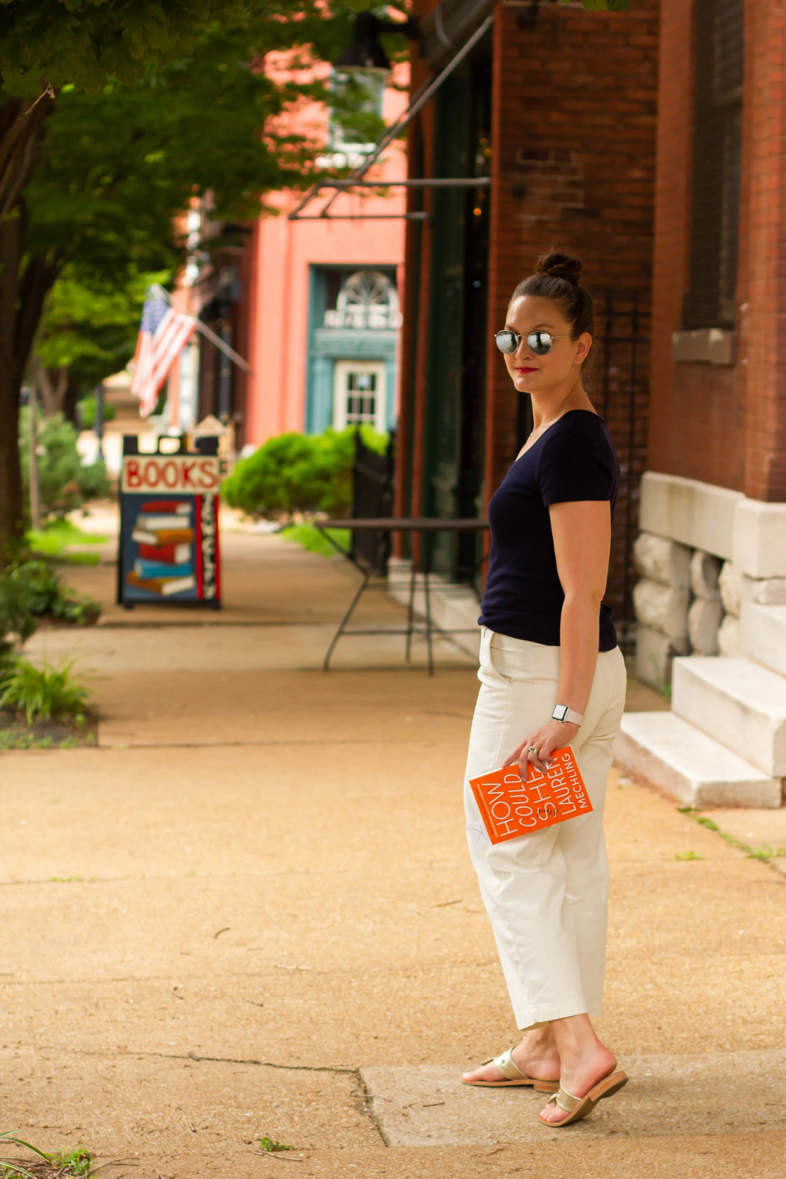 Reading How Could She by Lauren Mechling on Cherokee Street in St. Louis, MO