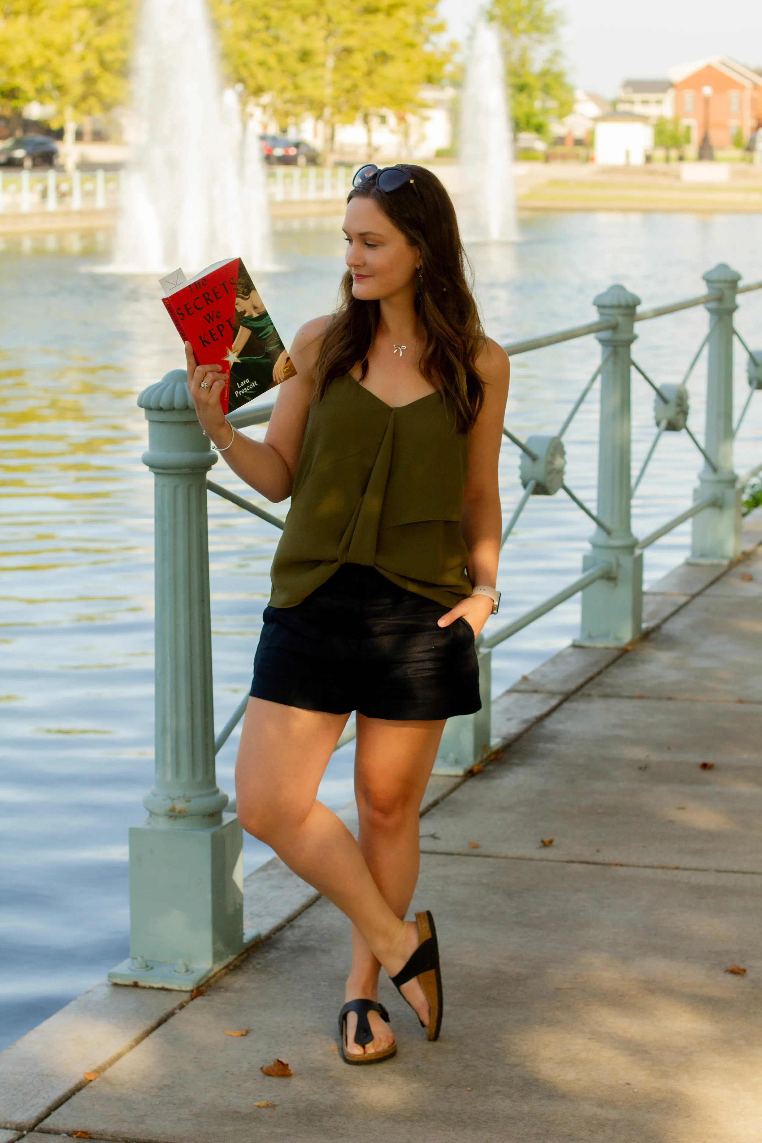 Reading The Secrets We Kept by Lara Prescott in New Town at St. Charles, MO