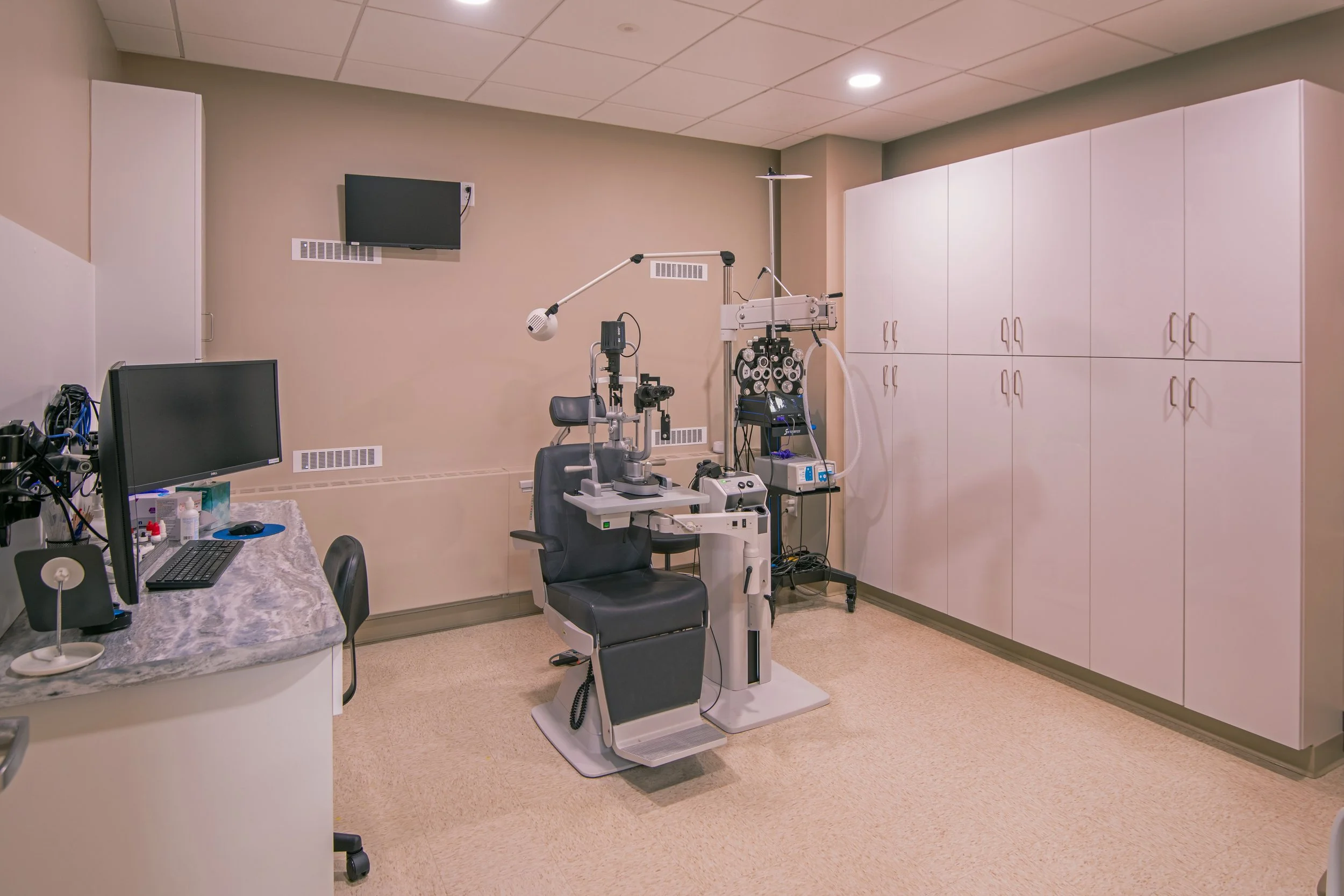 optical exam room with chair and cabinets