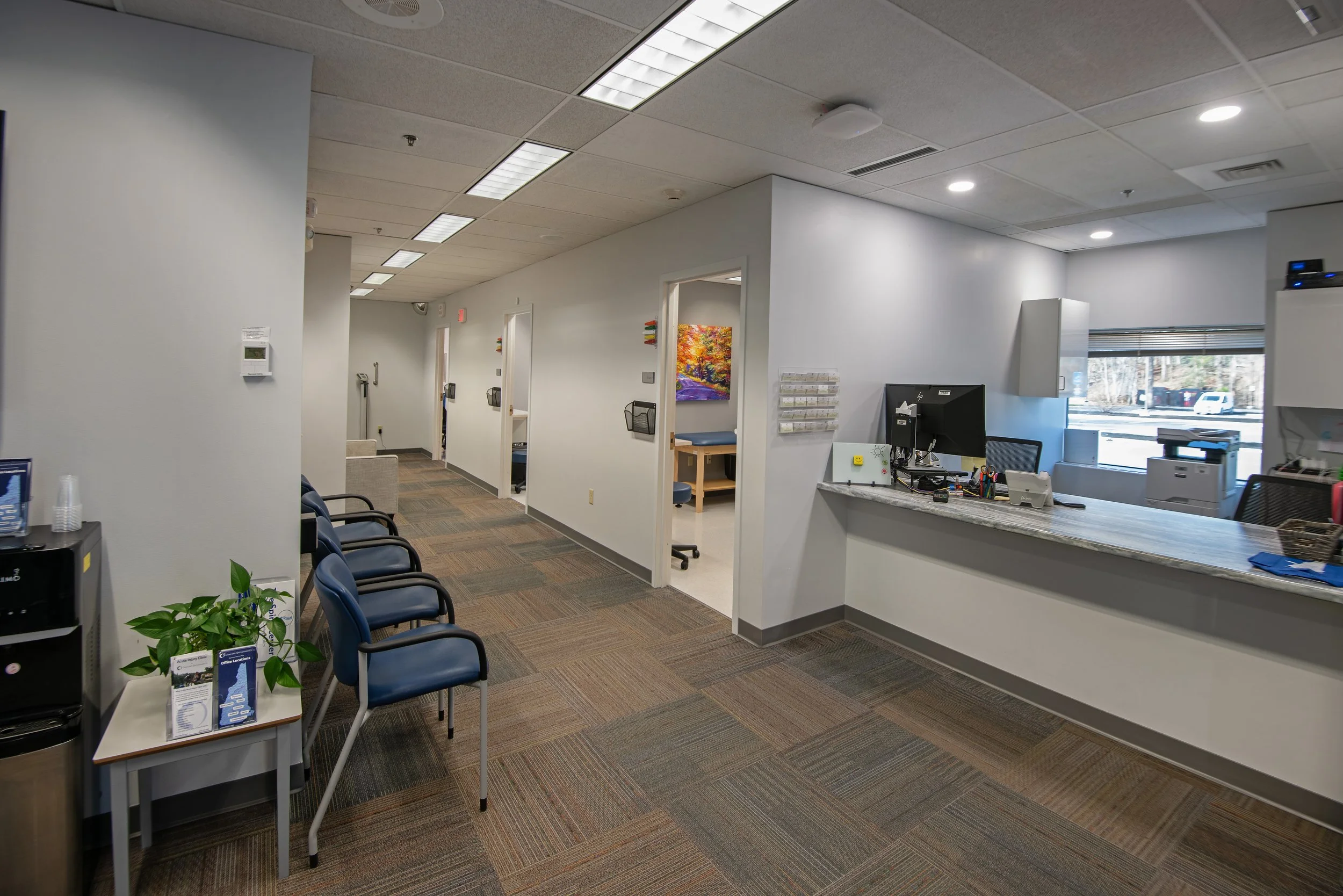 patient waiting area, hallway, and reception desk for orthopedic center
