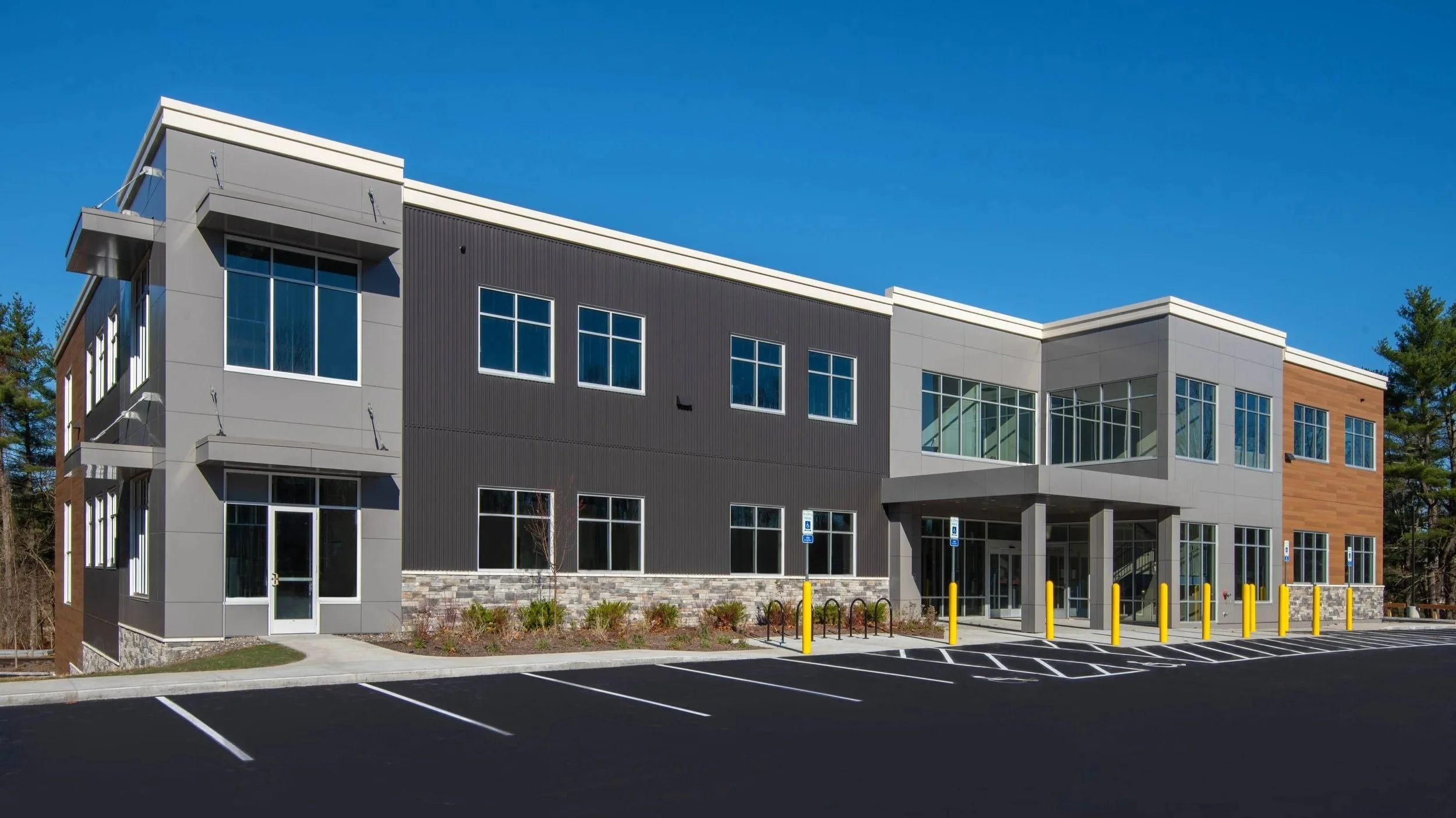 modern gray and brown 2 story medical building exterior