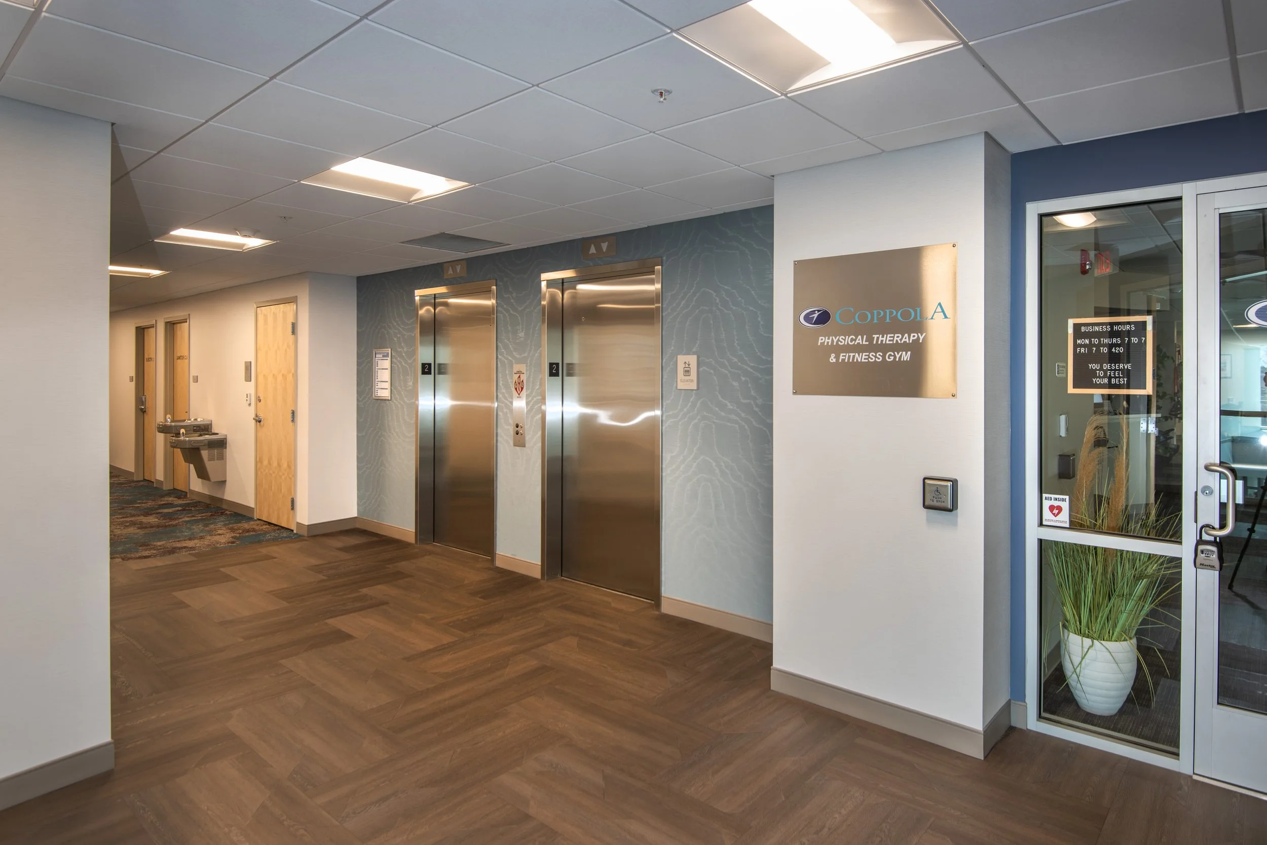 modern medical building hallway with 2 elevators