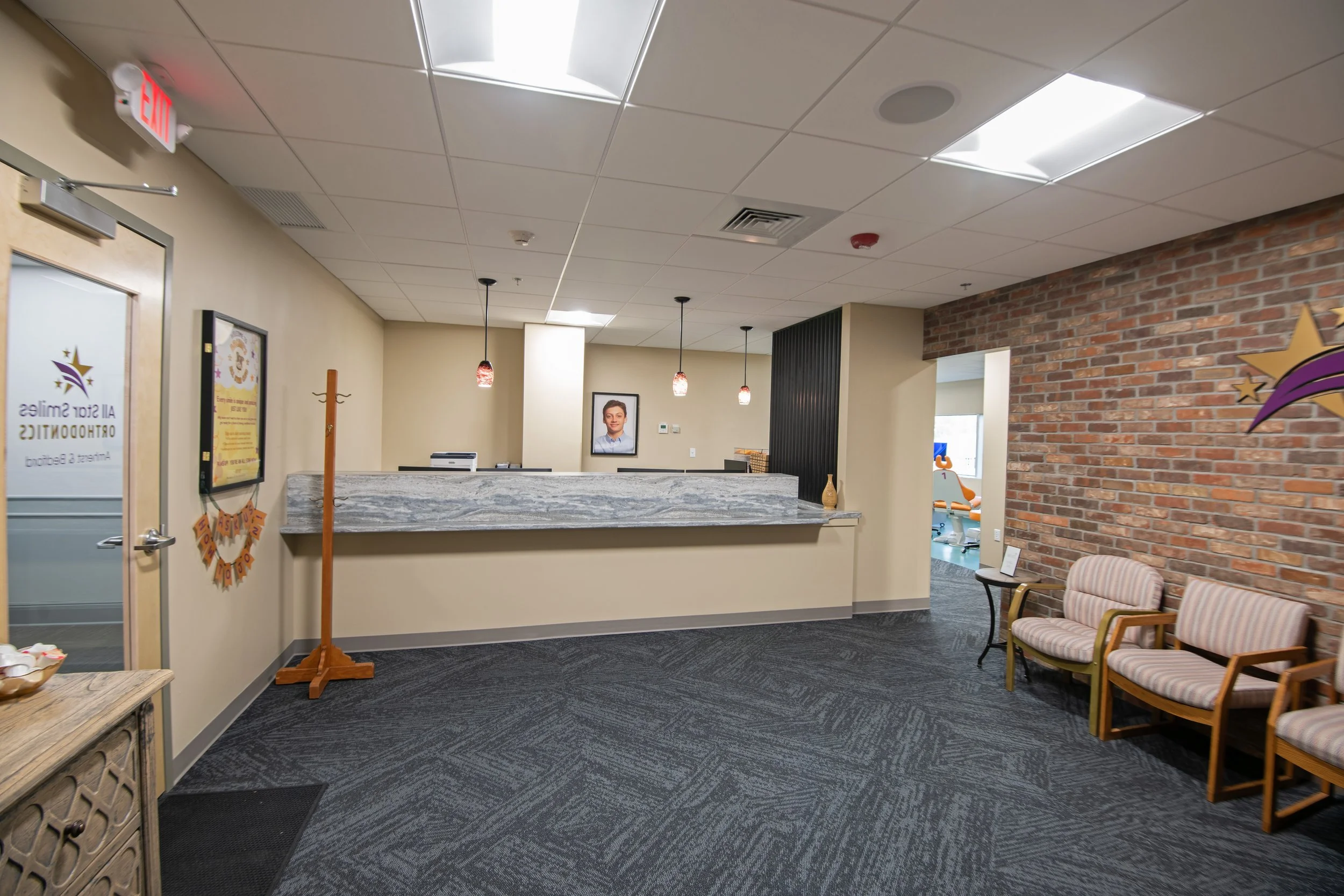 patient waiting area and reception desk for orthodontist office