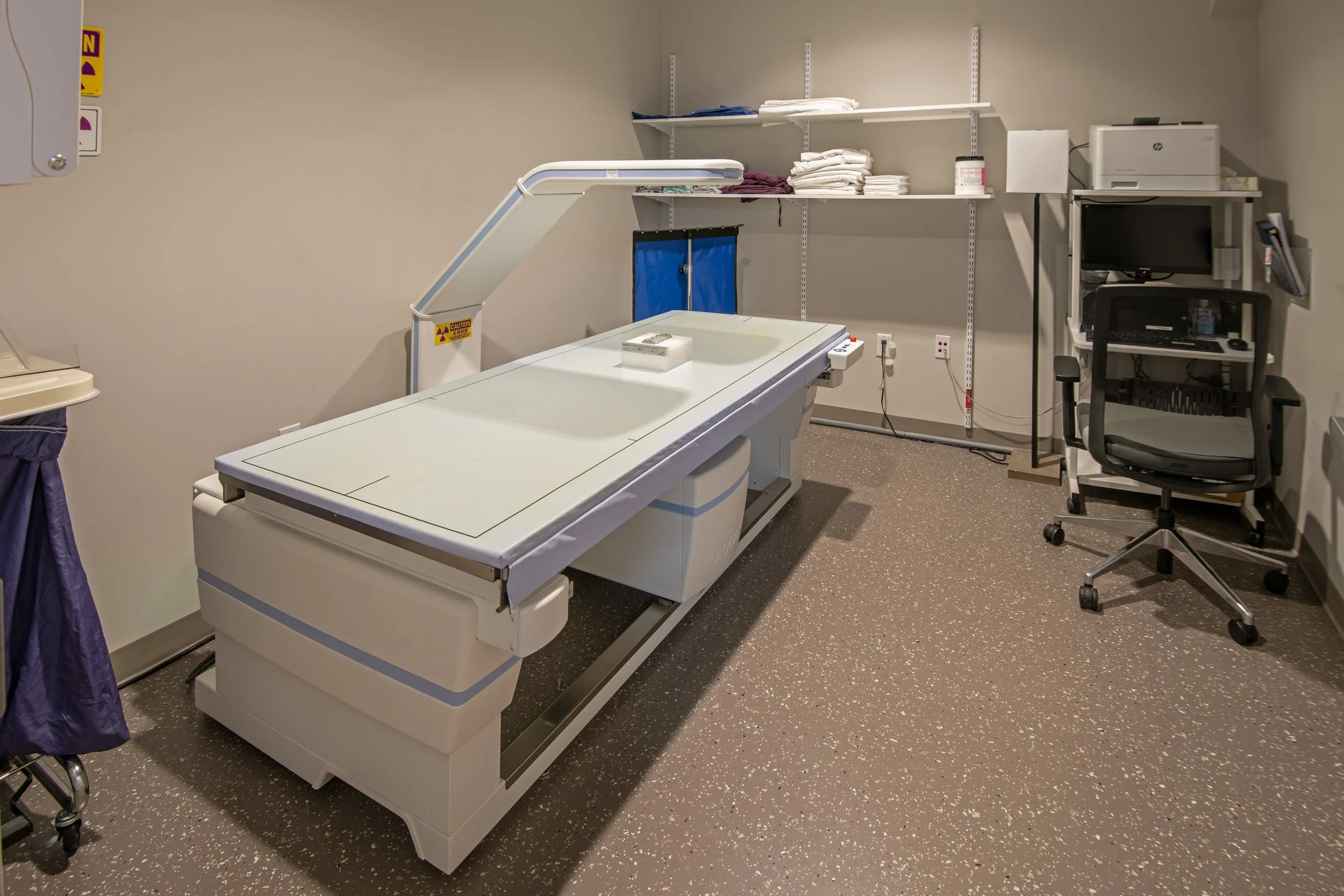 xray machine in patient exam room