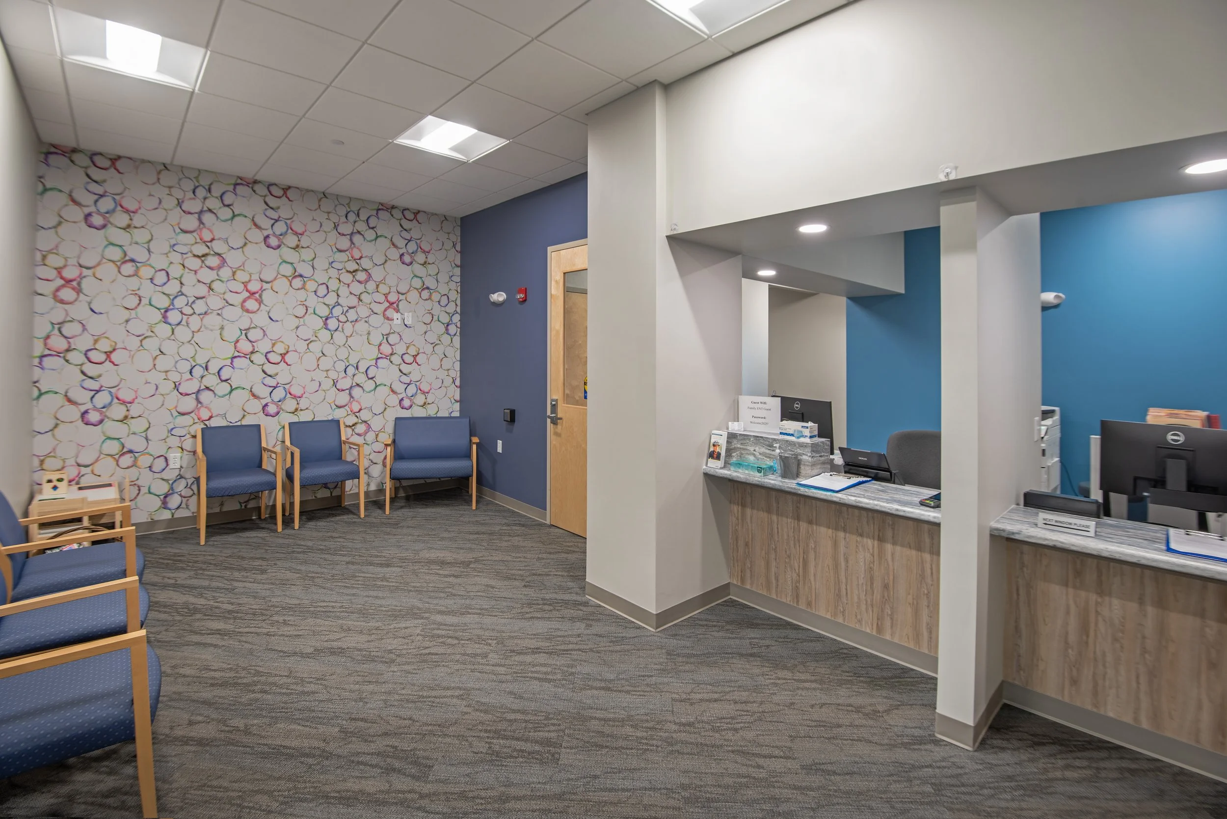 waiting area and reception desk for medical center