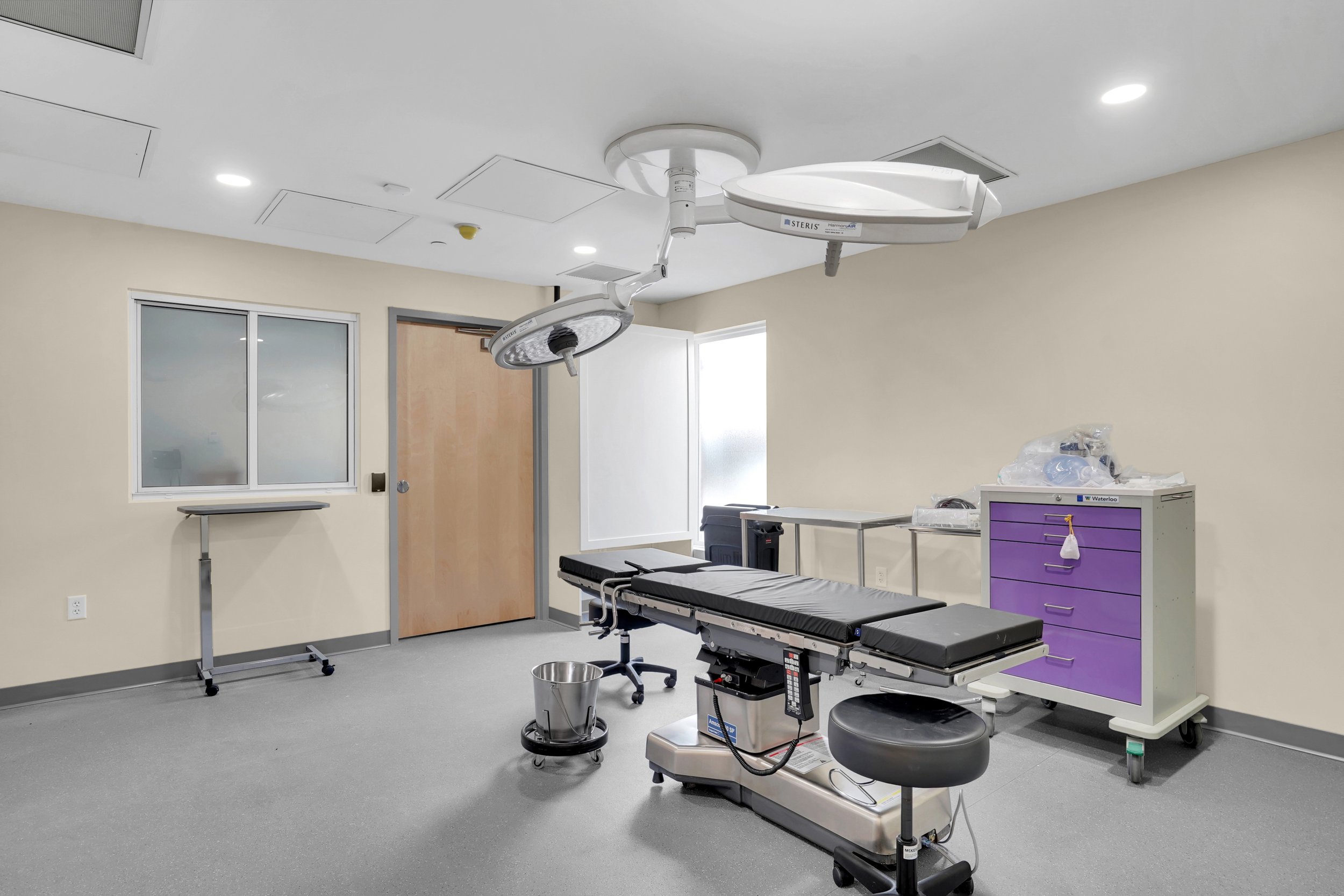 surgical room with patient table and operating lights