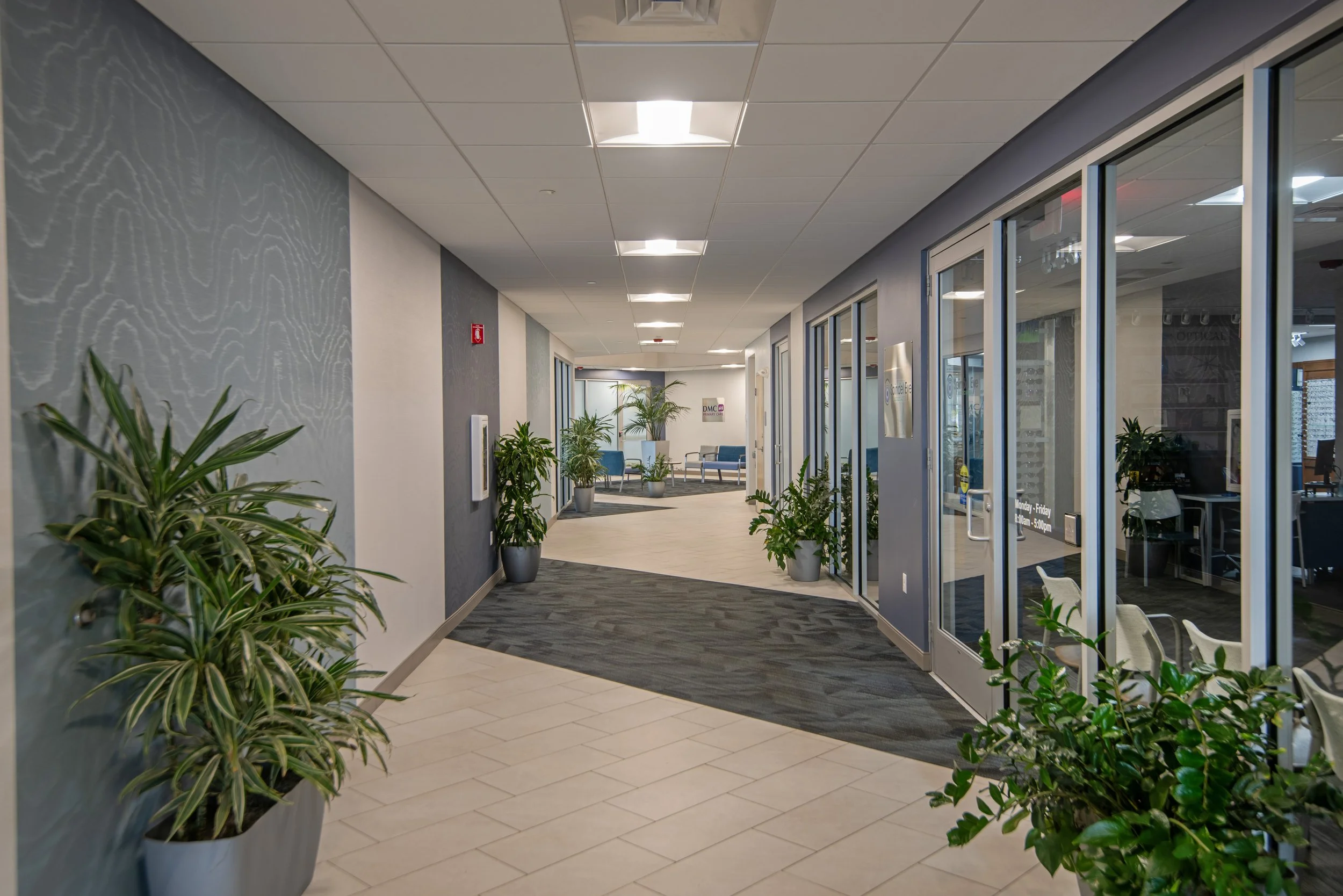 long hallway with patterned floor and glass doors