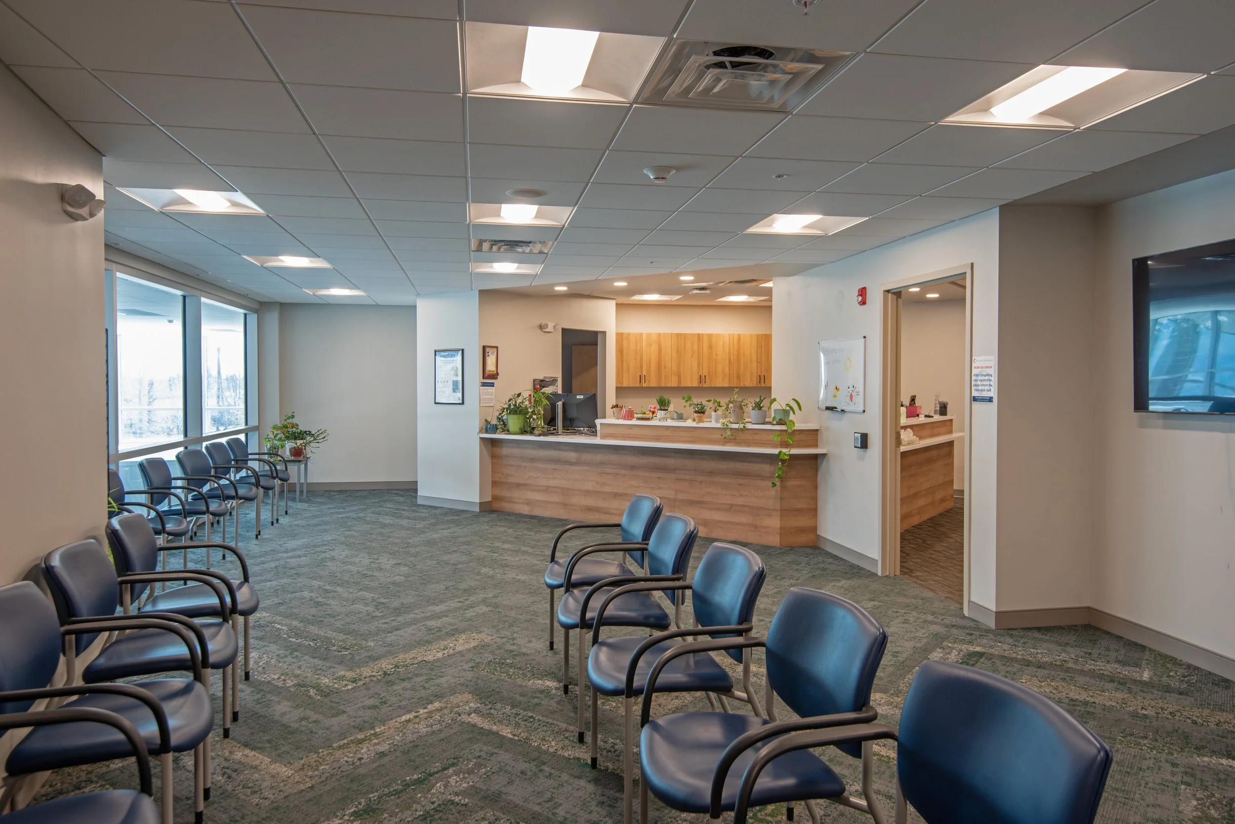 modern medical building patient waiting area and reception desk