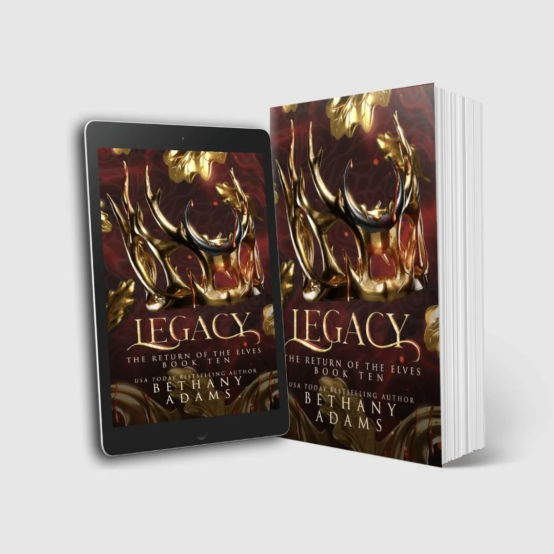 A paperback of Legacy and an ereader with the image of Legacy on the front.