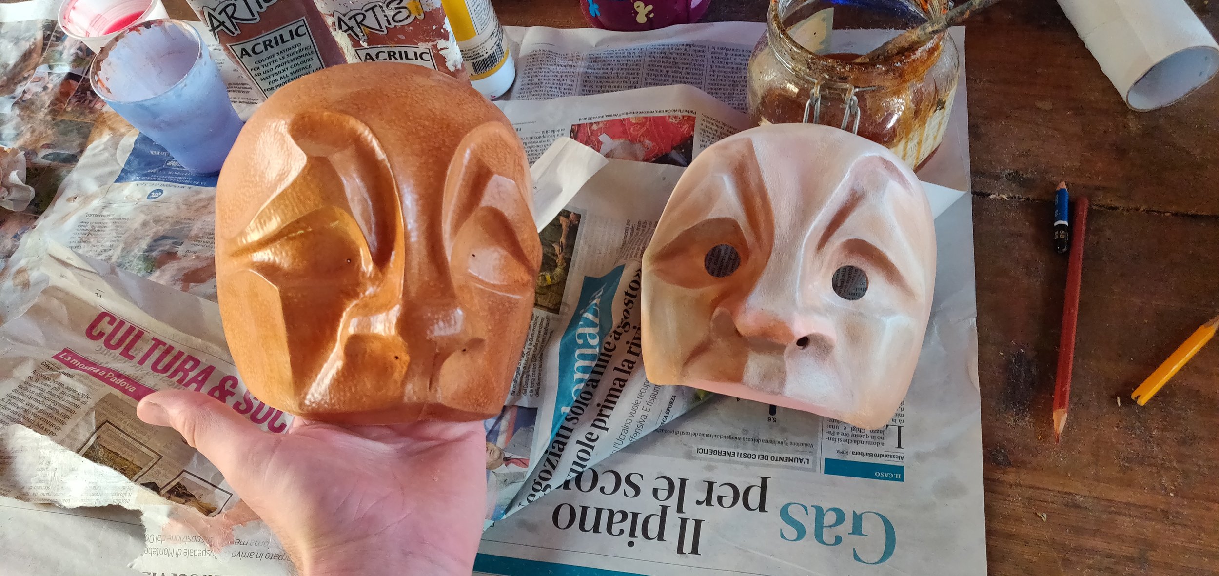 Leather mask in progress with painted papier mache