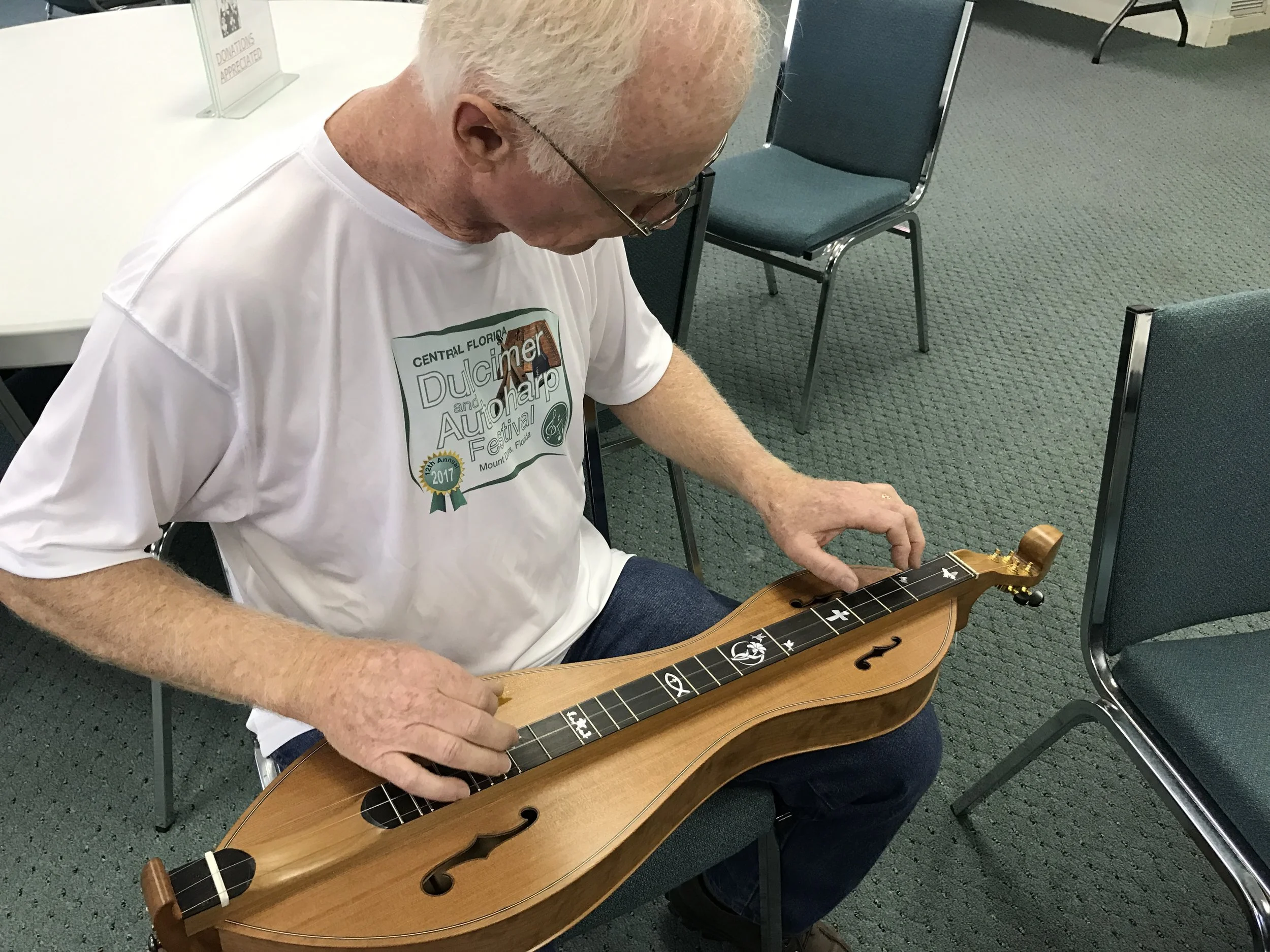 Gentleman Trying out One of My Dulcimers