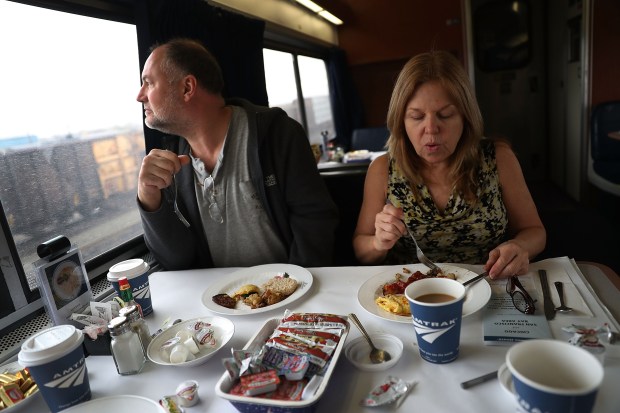 Bill Squier and Julie Blethen eat breakfast on Amtrak’s California Zephyr during its daily 2,438-mile trip to Emeryville/San Francisco from Chicago that takes roughly 52 hours on March 24, 2017 in Denver, Colorado.