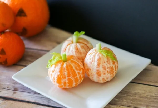 Mandy Pumpkin: Peel mandarin oranges. Cut a small hole in the middle of it and insert a thin slice of celery. 