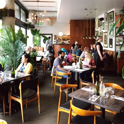 Patrons enjoying brunch at the well-decorated Tallulah's in Capitol Hill