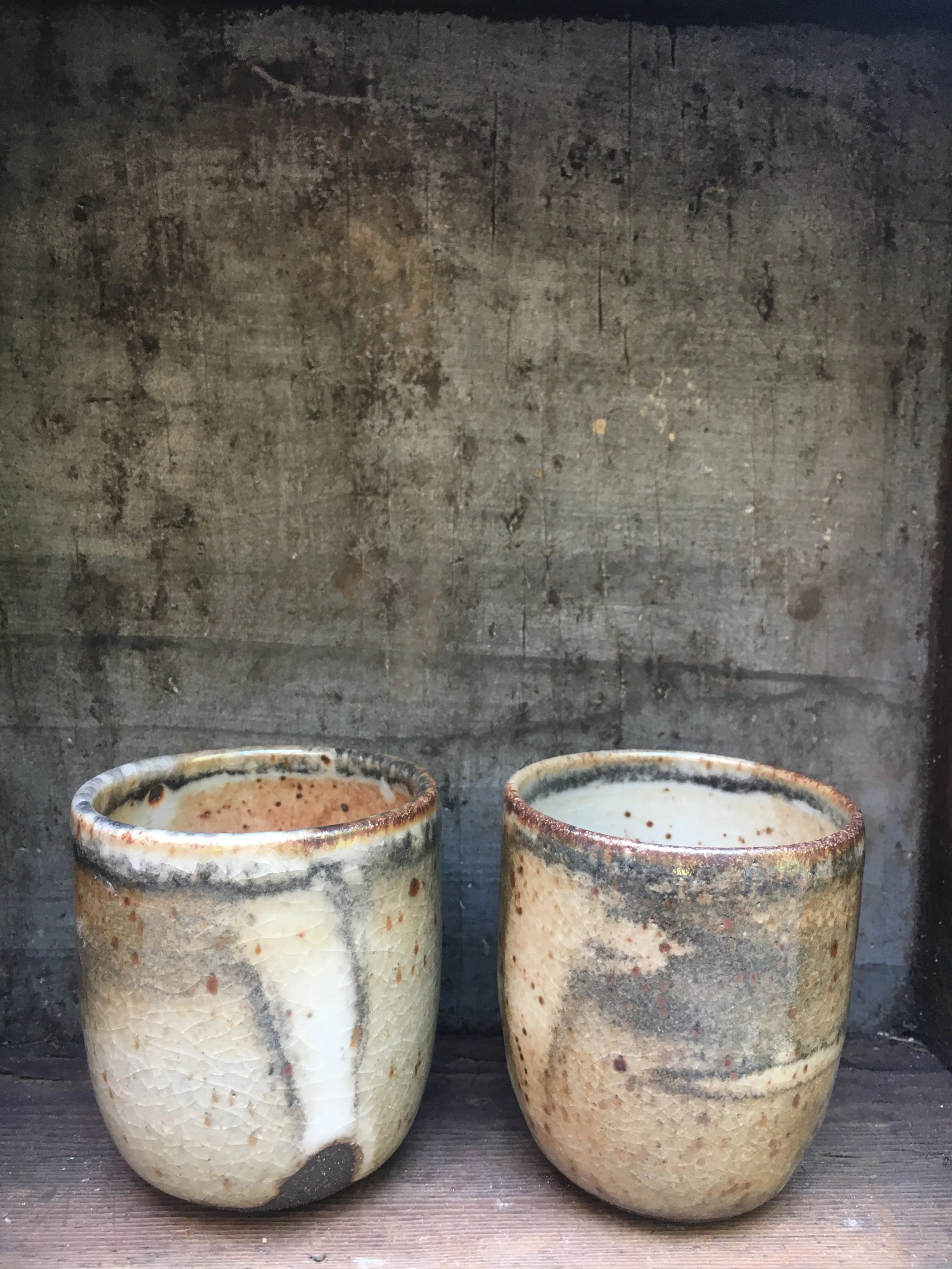 Set of two stoneware tumblers with shino glaze