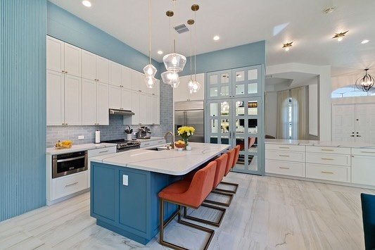 Step into a bright open kitchen that we designed to be the centerpiece of this family home. #biographicaldesign #interiordesign #kitchendesign #thekitchenismyhappyplace #familytime #cooking #blue