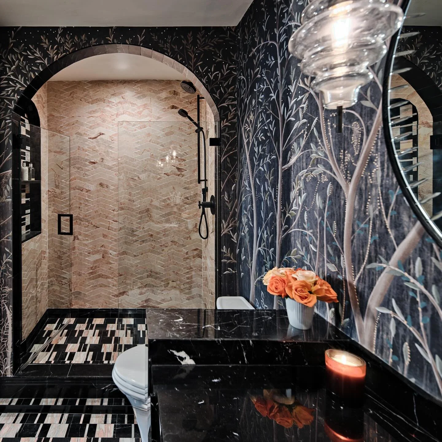 Moody, mysterious, and a little bit magical 🌑✨ This bathroom isn&rsquo;t shy about making a statement: a grand archway shower, mosaic floors that dance with pattern, and a forest mural that feels straight out of a fairytale. 🌲 Add in the drama of b