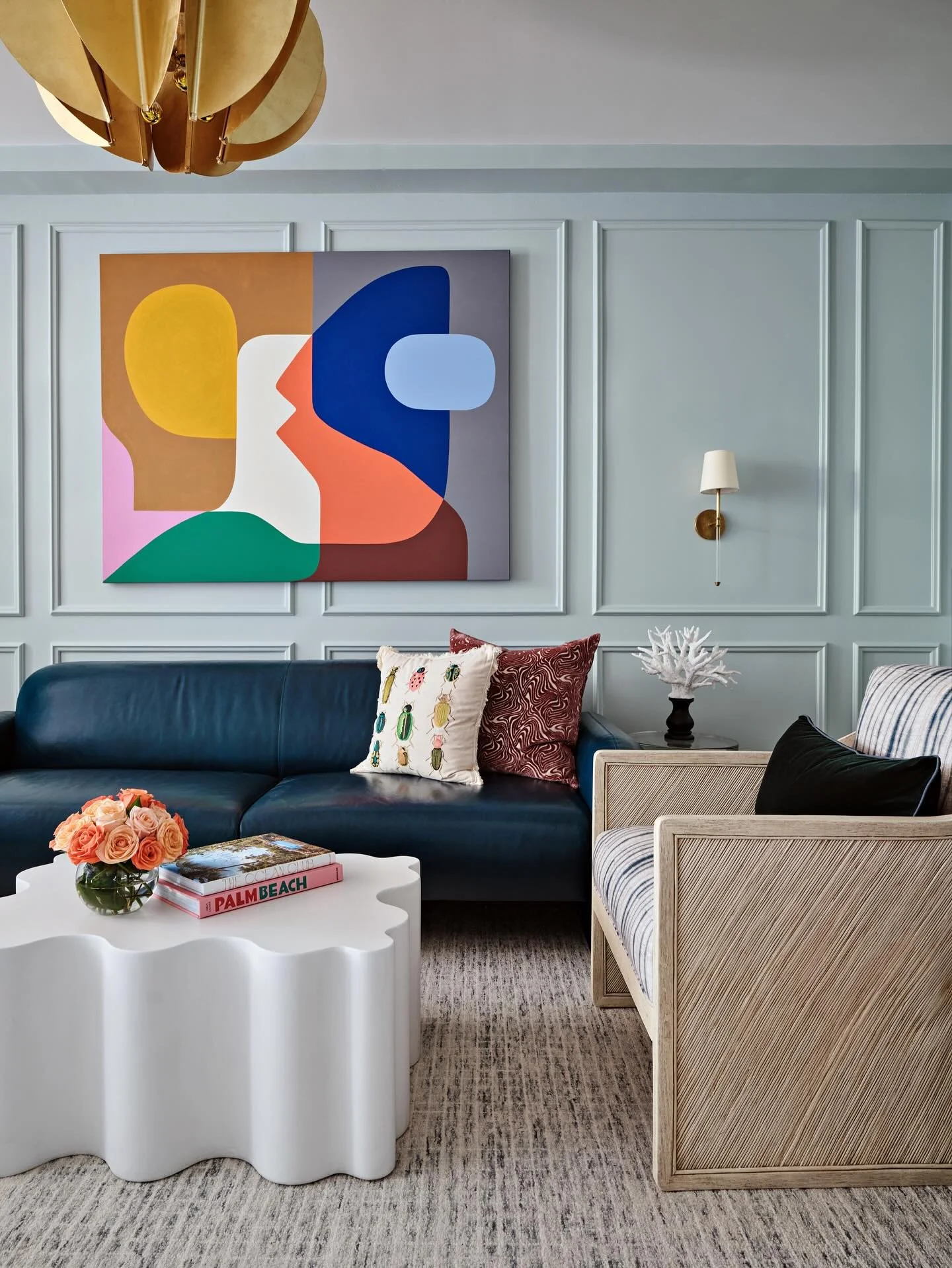 Soft blue walls, timeless moldings, and abstract art in dialogue &mdash; a study in contrast that keeps this sitting room feeling both classic and current.
#biographicaldesign #miamimaximalism #artcollector