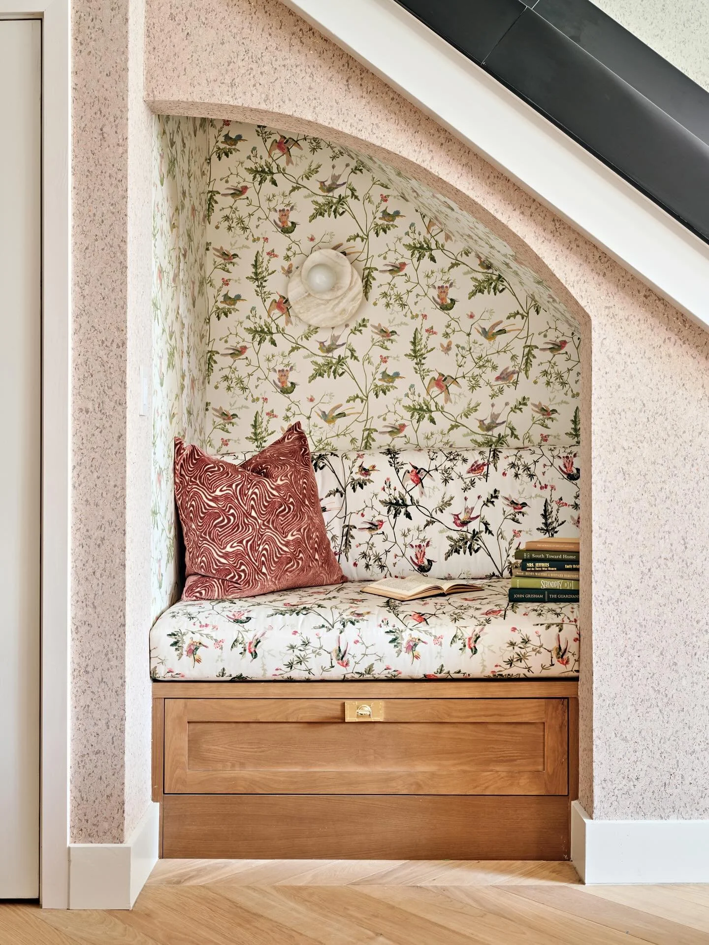 Tucked beneath the stairs, this little reading nook proves that pattern-on-pattern is pure magic. We layered bold prints, saturated hues, and textured textiles to turn an overlooked corner into a pattern-drenched escape.

It&rsquo;s the kind of spot 
