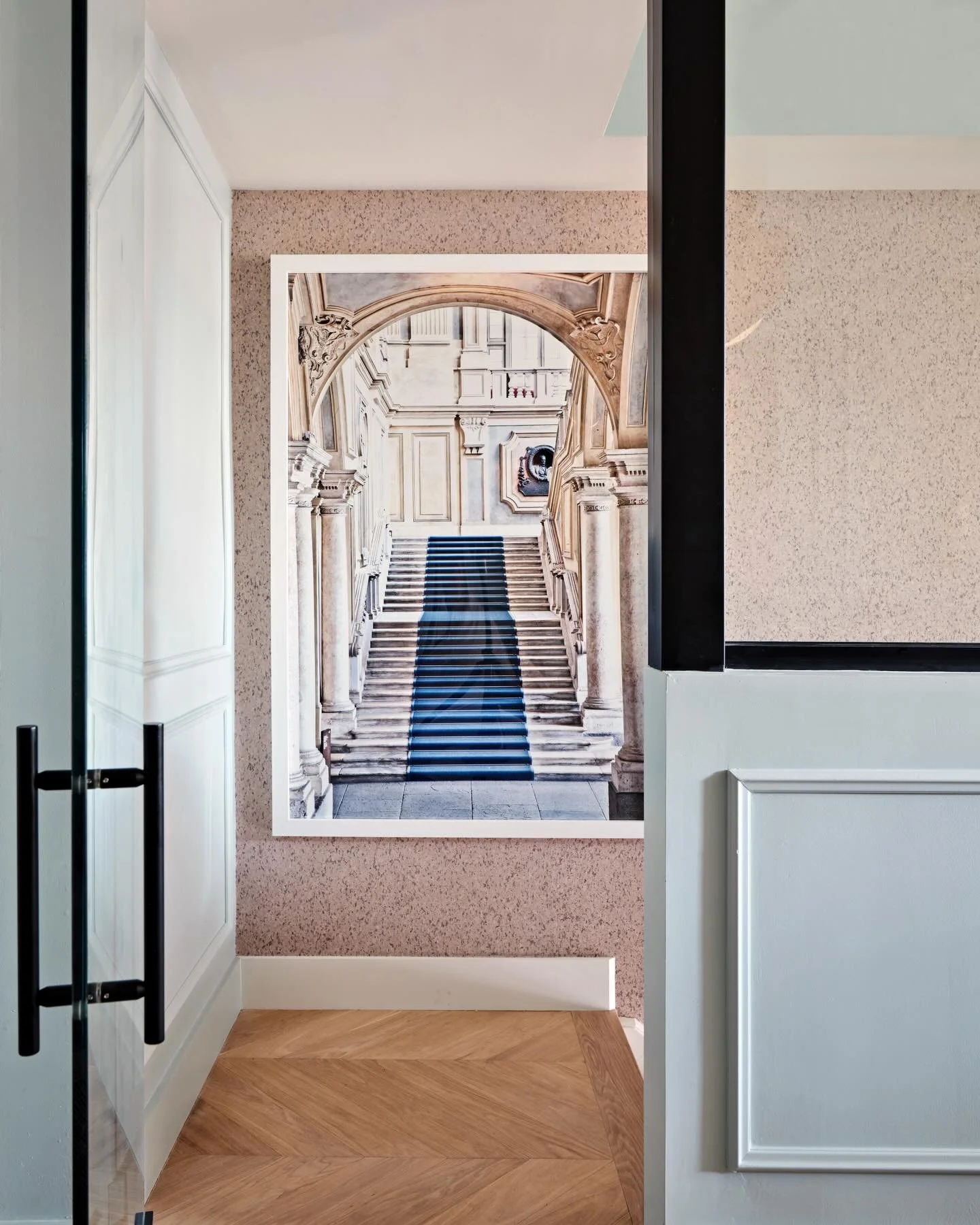 The perfectly curated art can make a space come to life.

In this room, a large-scale architectural photograph doesn&rsquo;t just hang on the wall &mdash; it becomes part of the architecture itself. It anchors the palette, expands the perspective, an