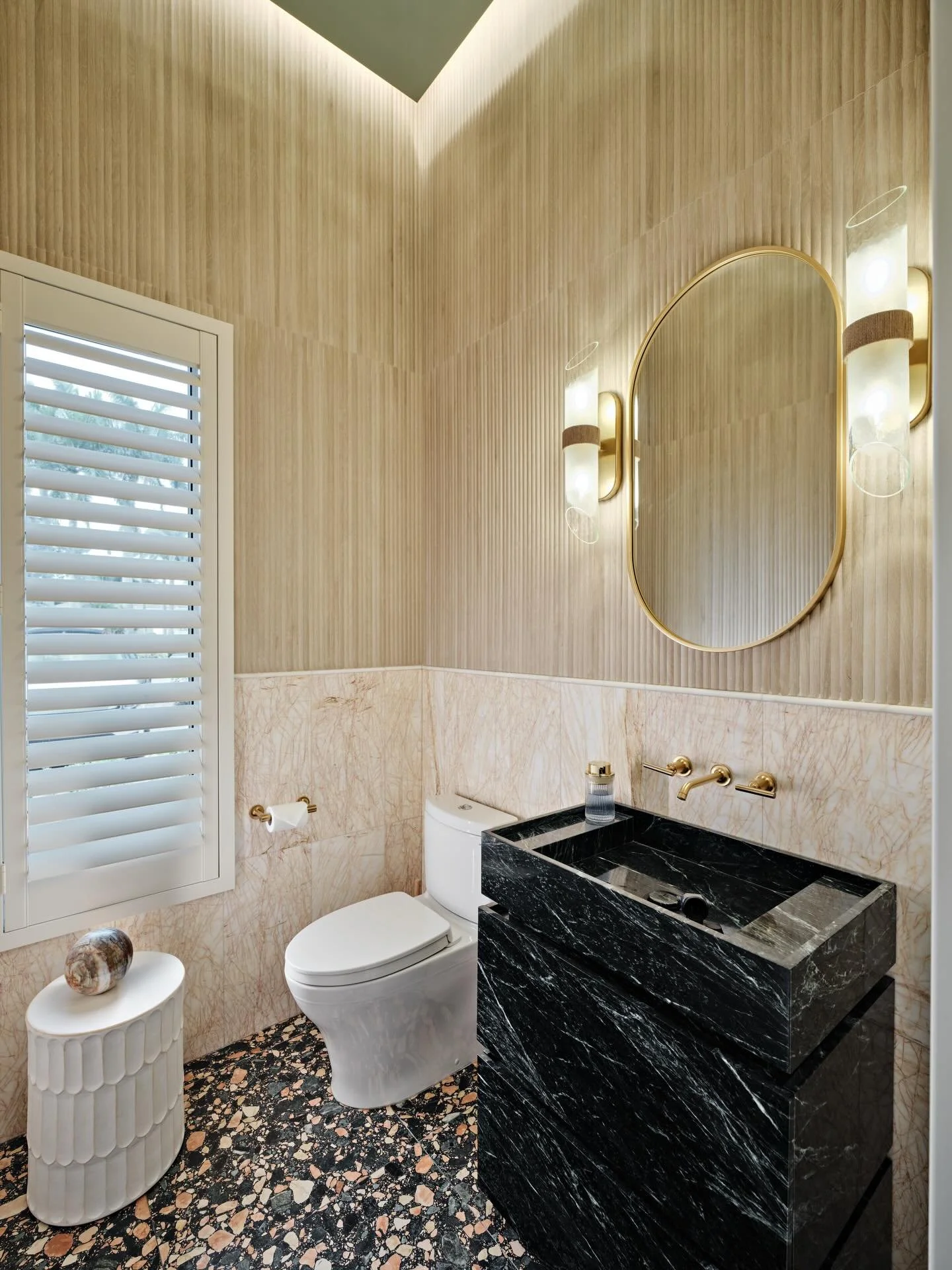 Powder rooms are where we let the story get bold.

This one is intimate, layered, and unapologetically expressive. Rich textures, sculptural lighting, and a palette that feels collected rather than chosen. A jewel box moment designed to surprise, del