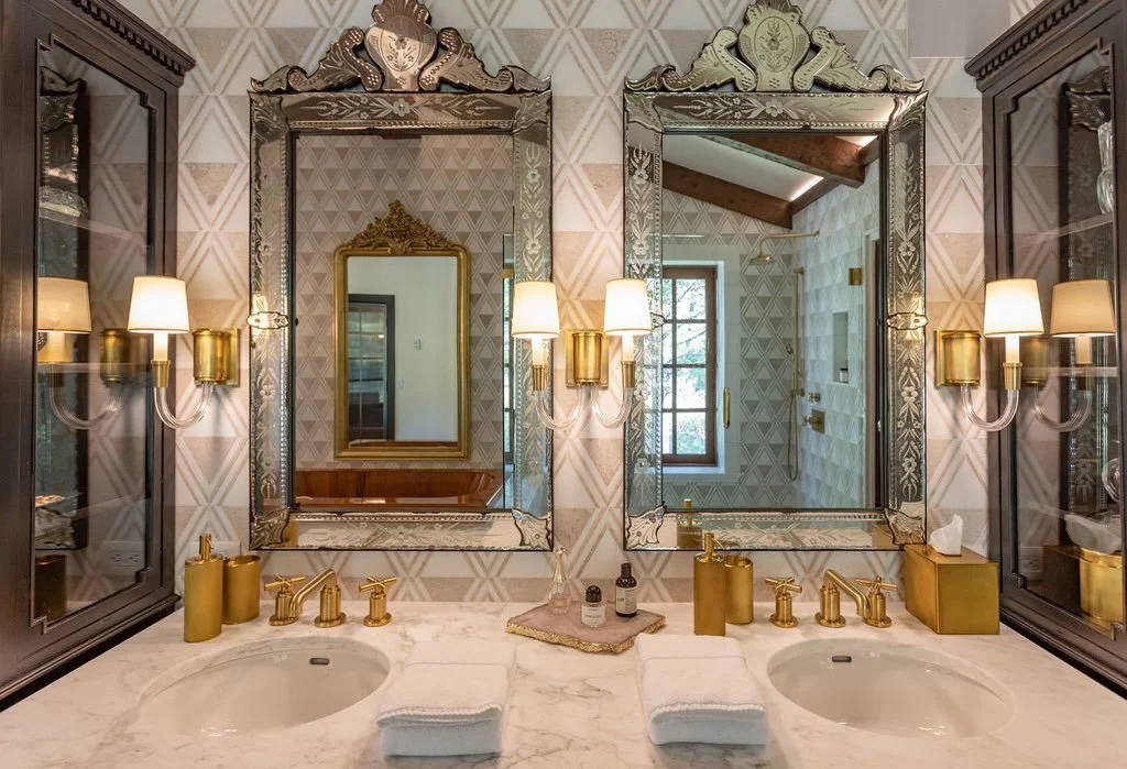 A little bit of drama goes a long way.

A room that reminds you&mdash;daily&mdash;that you deserve beauty, indulgence, and a little bit of glamour. From the shimmer of mosaic marble to the glow of gold, this is more than a bathroom. It&rsquo;s a mome