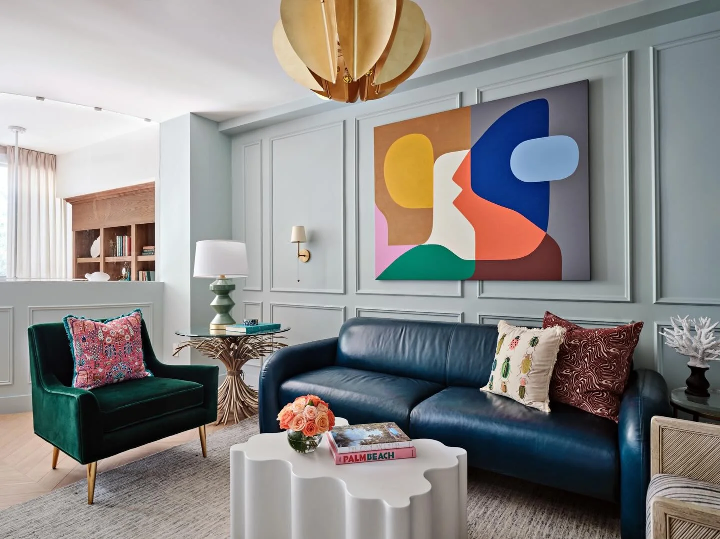 A sitting room for an art collector. Anchored by a fabulous painting by Stephen Ormandy, this space balances softness with bold artistic expression. Pale blue wall paneling, sculptural furniture, and an artful composition create a room that feels lay
