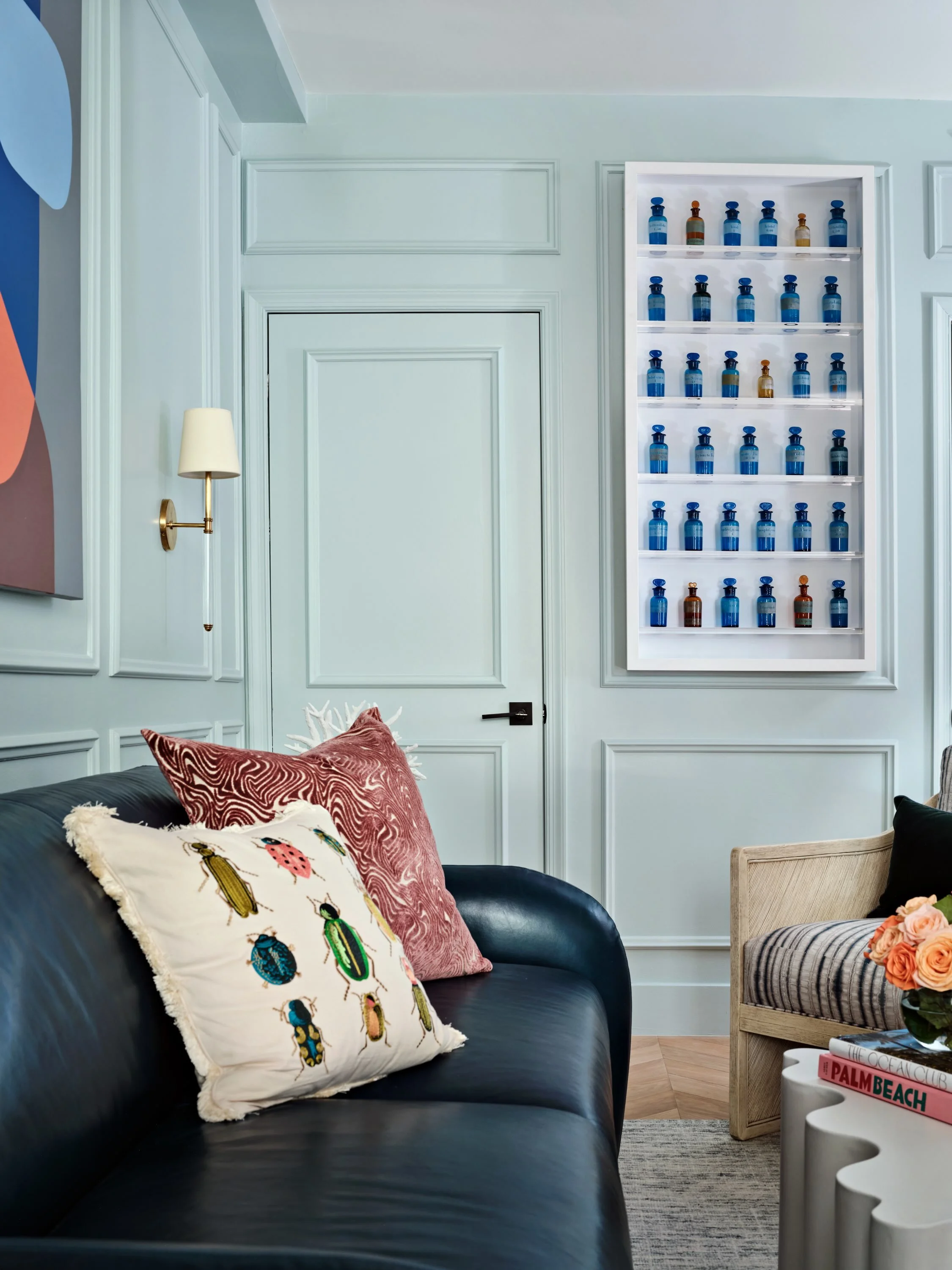 Robin&rsquo;s egg blue paneling makes the perfect backdrop for our client&rsquo;s bold art collection. Soft, unexpected, and full of character, the color gives each piece room to shine while turning the architecture itself into part of the compositio