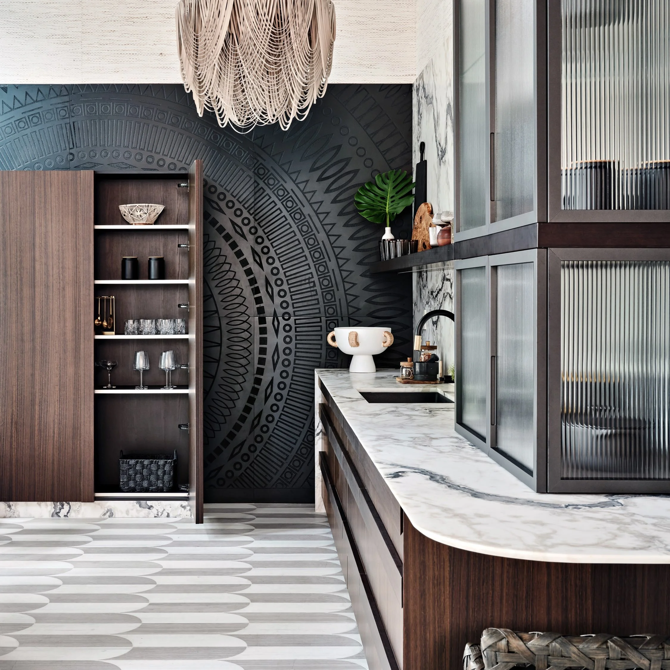 More is more when every detail has something to say. A bold hand-carved wall sets the tone, layered with rich textures, natural materials, and unexpected moments that make this kitchen anything but ordinary.

#BiographicalDesign #MiamiMaximalism #Kit
