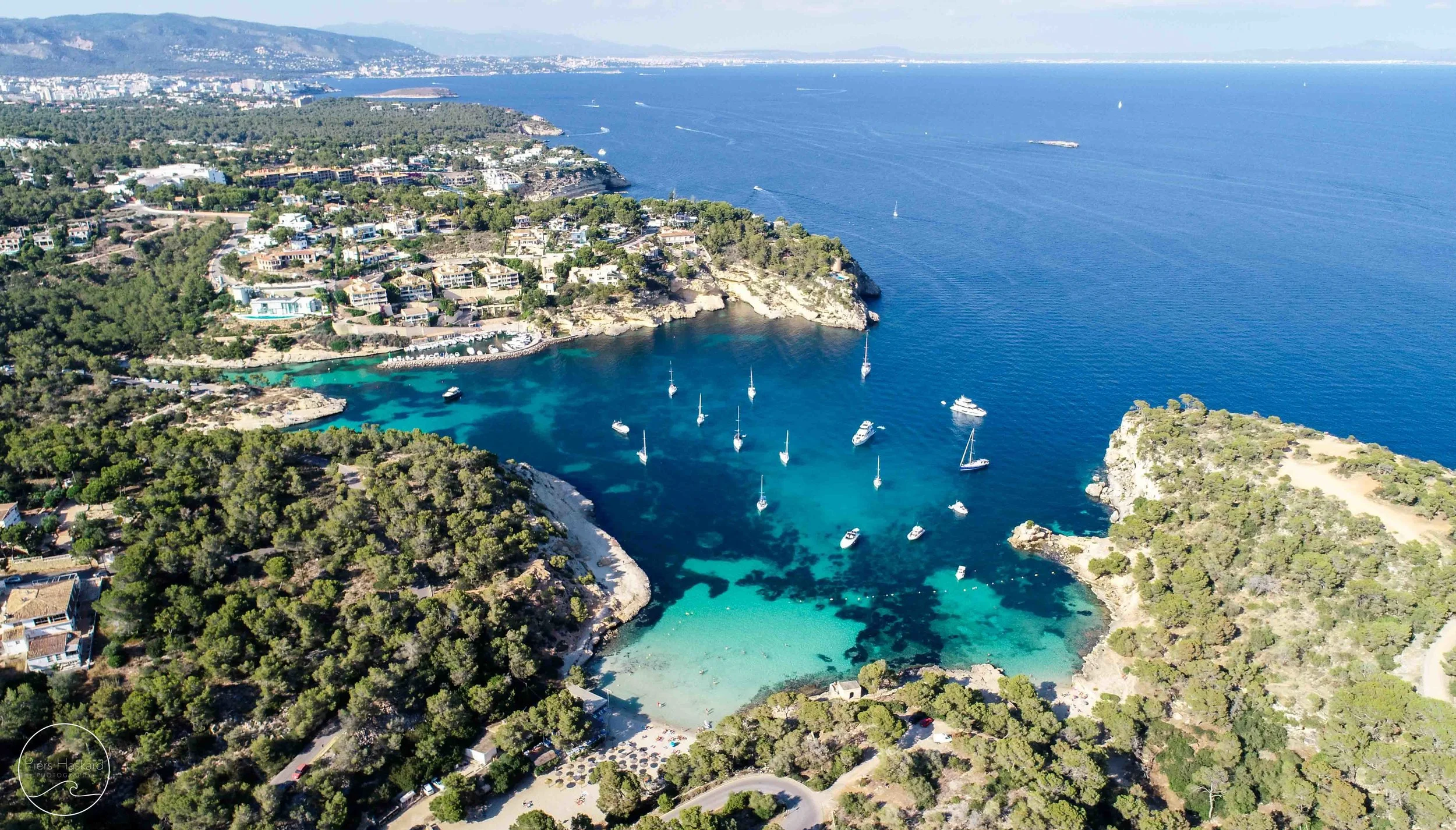 Platja Portals Vells from above, epic little swimming spots and popular with the boats too.