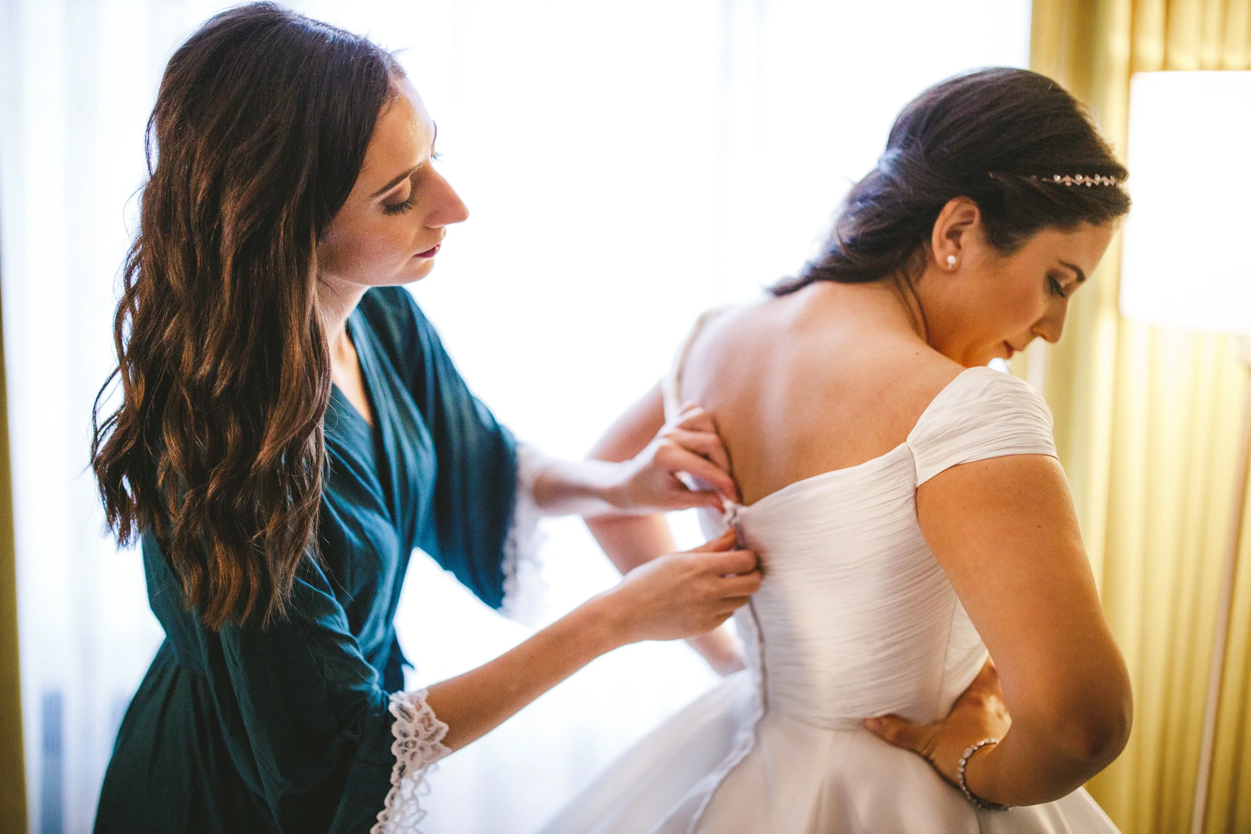 Bride getting her dress on