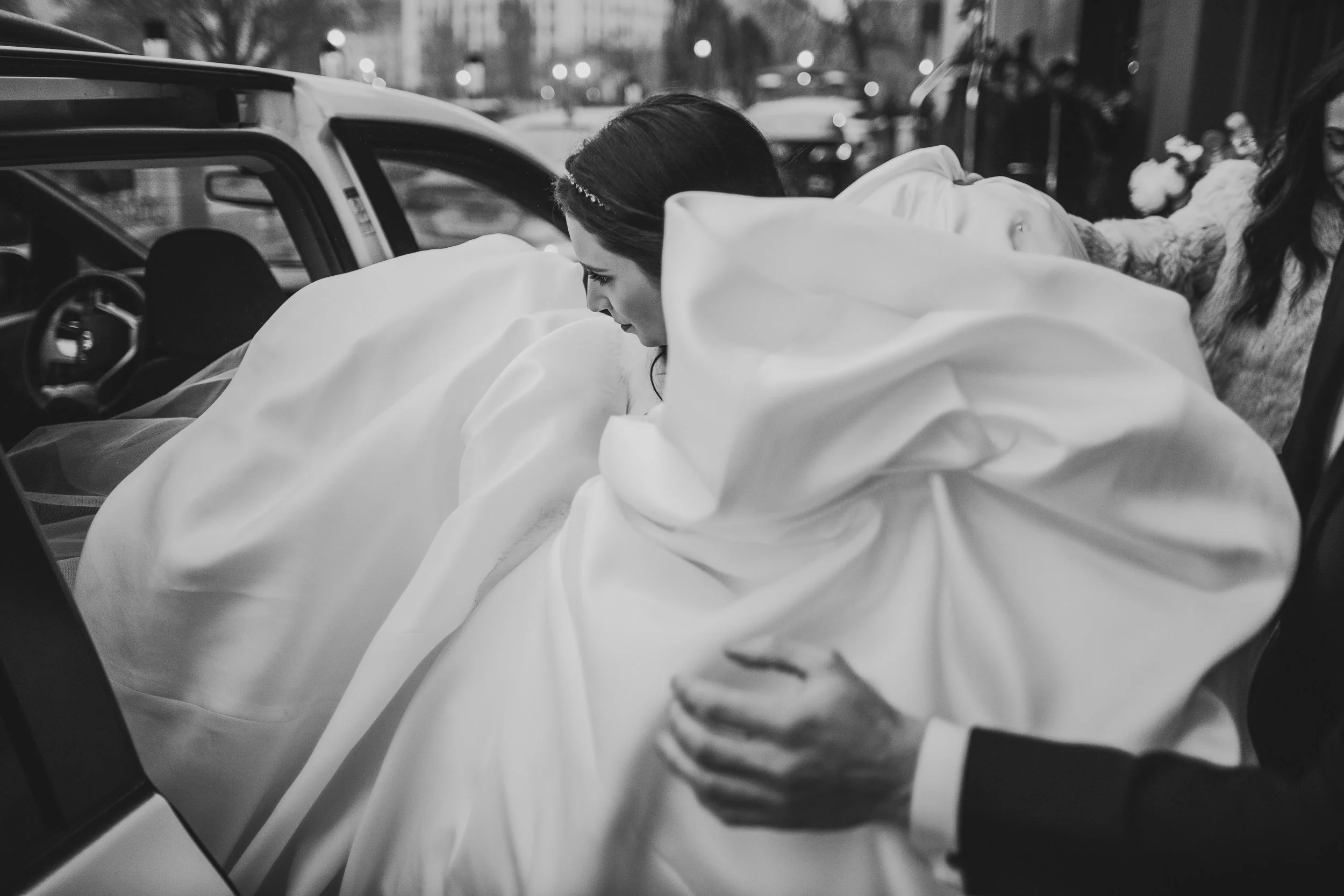 wedding dress into car