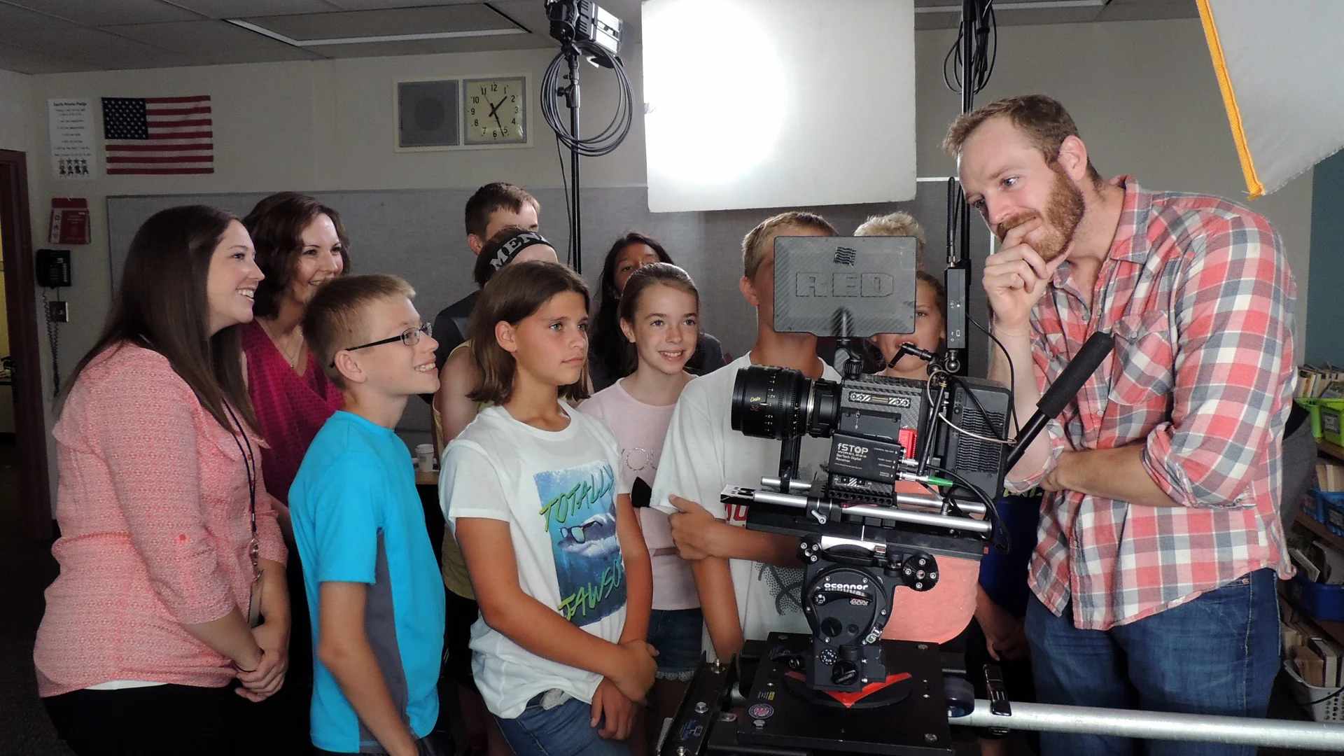 These sixth and seventh graders from Grimes, Iowa were jazzed to help out with our production and had plenty of acting chops to showcase for the camera. In this shot, Scott assumes a classic "pensive director" pose as he reviews a crucial shot with the cast.