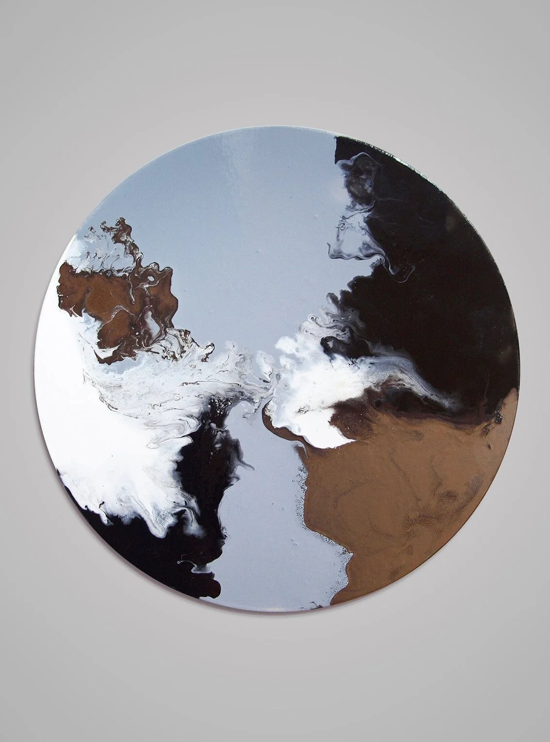 Abstract circular artwork with black, white, brown, and gray swirling colors on a gray background.