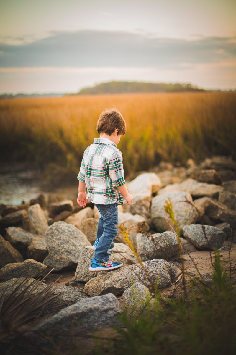 boy walking on rocks / outdoors / savannah ga
