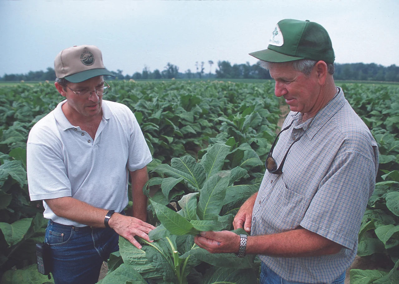Local District Conservationist discussed conservation with this tobacco farmer in North Carolina. Photo by Bob Nichols, USDA Natural Resources Conservation Service , 2011.