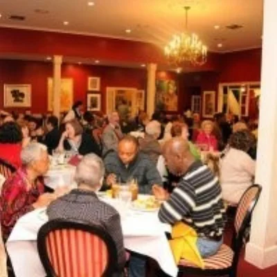 Dooky Chase’s Restaurant – white linen tablecloths and art everywhere