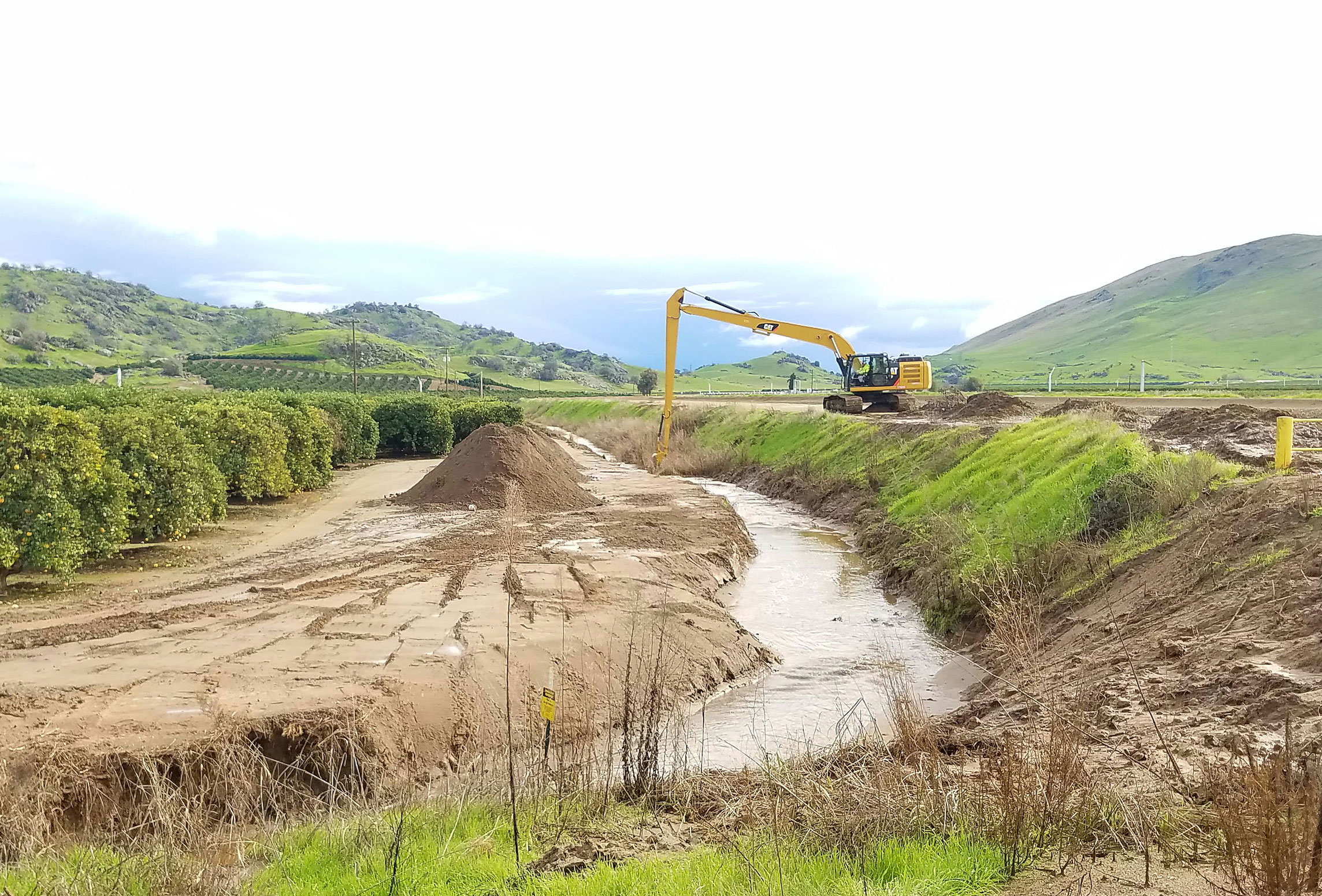  Drainage ditch being cleared of debris in the Orange Cove Section of the Friant Kern Canal 