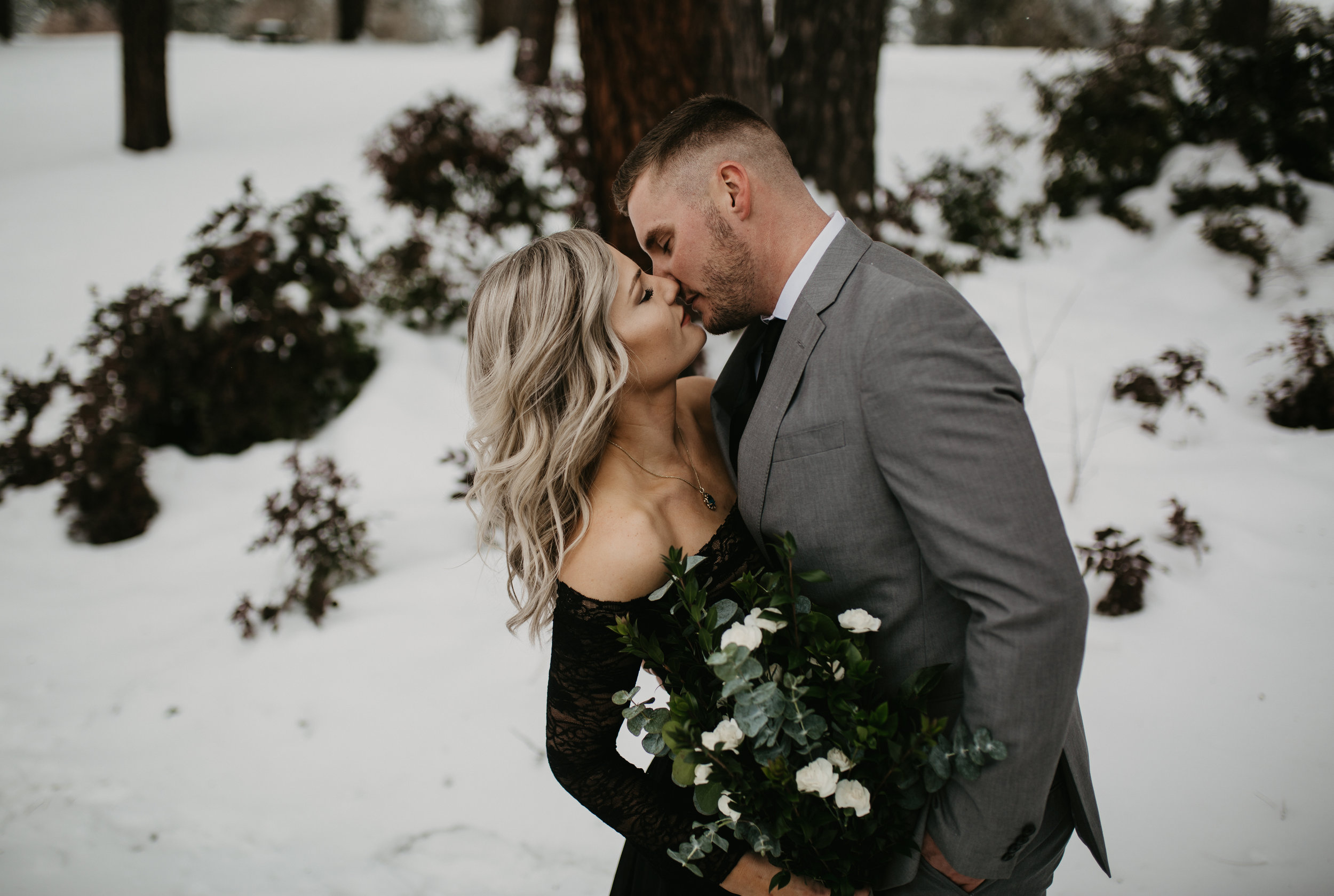  Bride and Groom kissing in the snow in Coeur d Alene Idaho 
