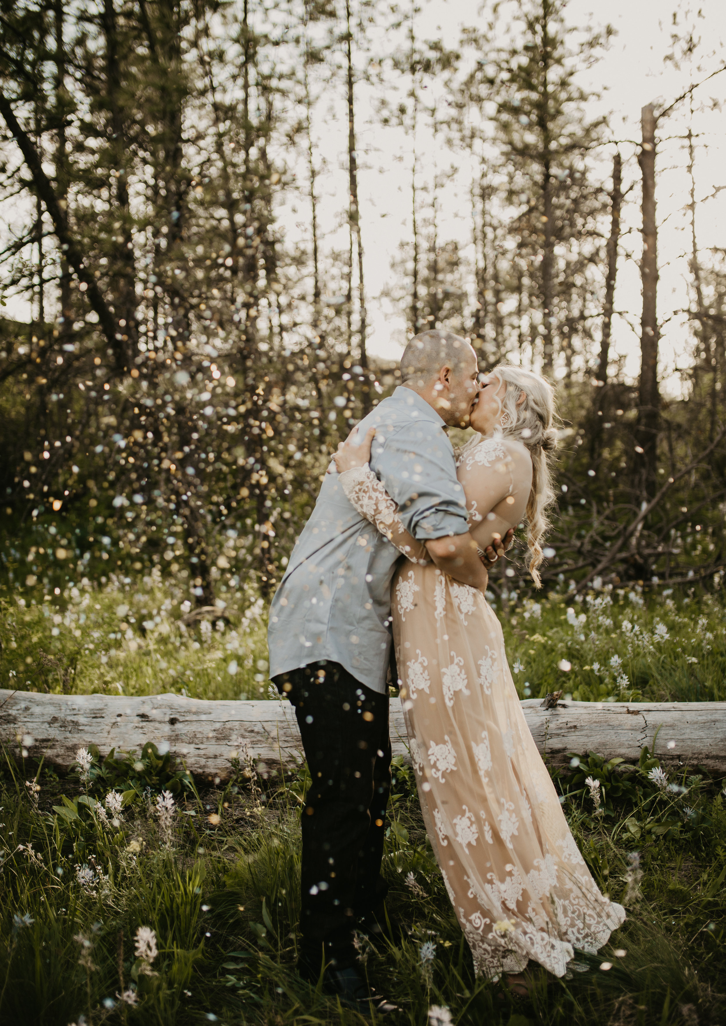  First kiss taken during first wedding with some fairy dust thrown above them 