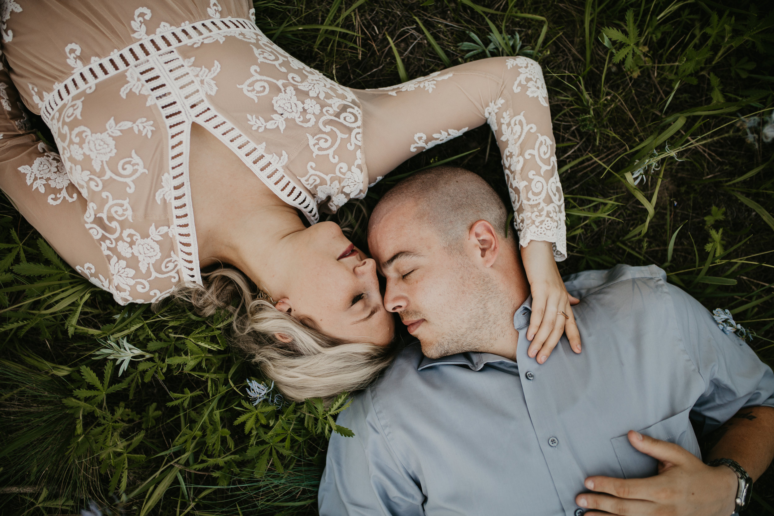  Bride and Groom laying down during photoshoot 