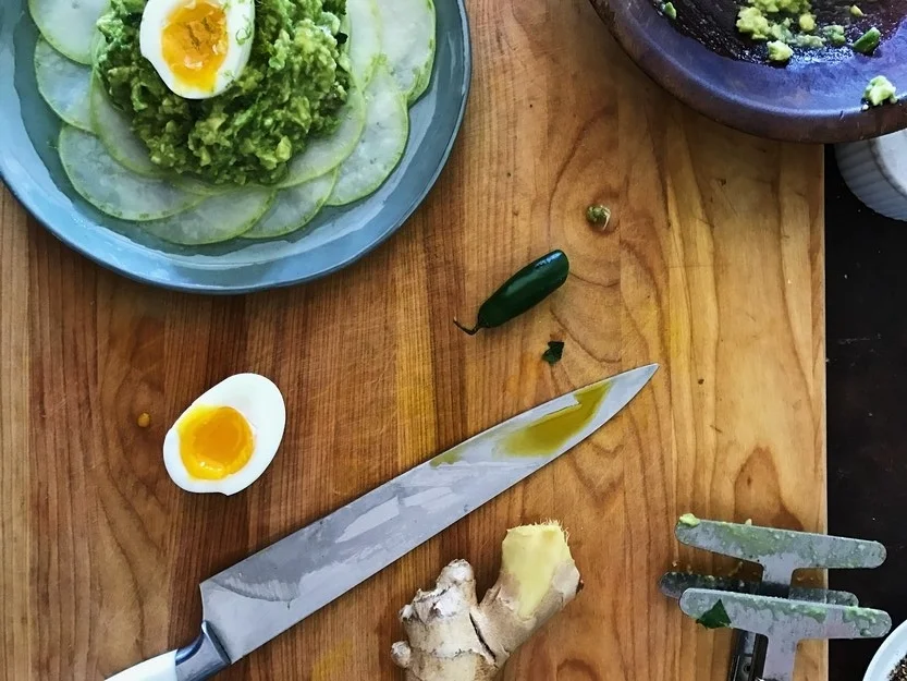 Kitchen counter with ingredients for Shaved Kohlrabi with Smashed Avocado