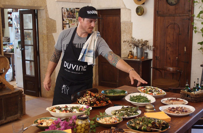 Seamus Mullen cooking for guests on Duvine Chef On Wheels Bike Tour