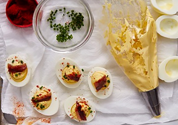 Preparing Deviled Eggs with Anchovies and Rosemary
