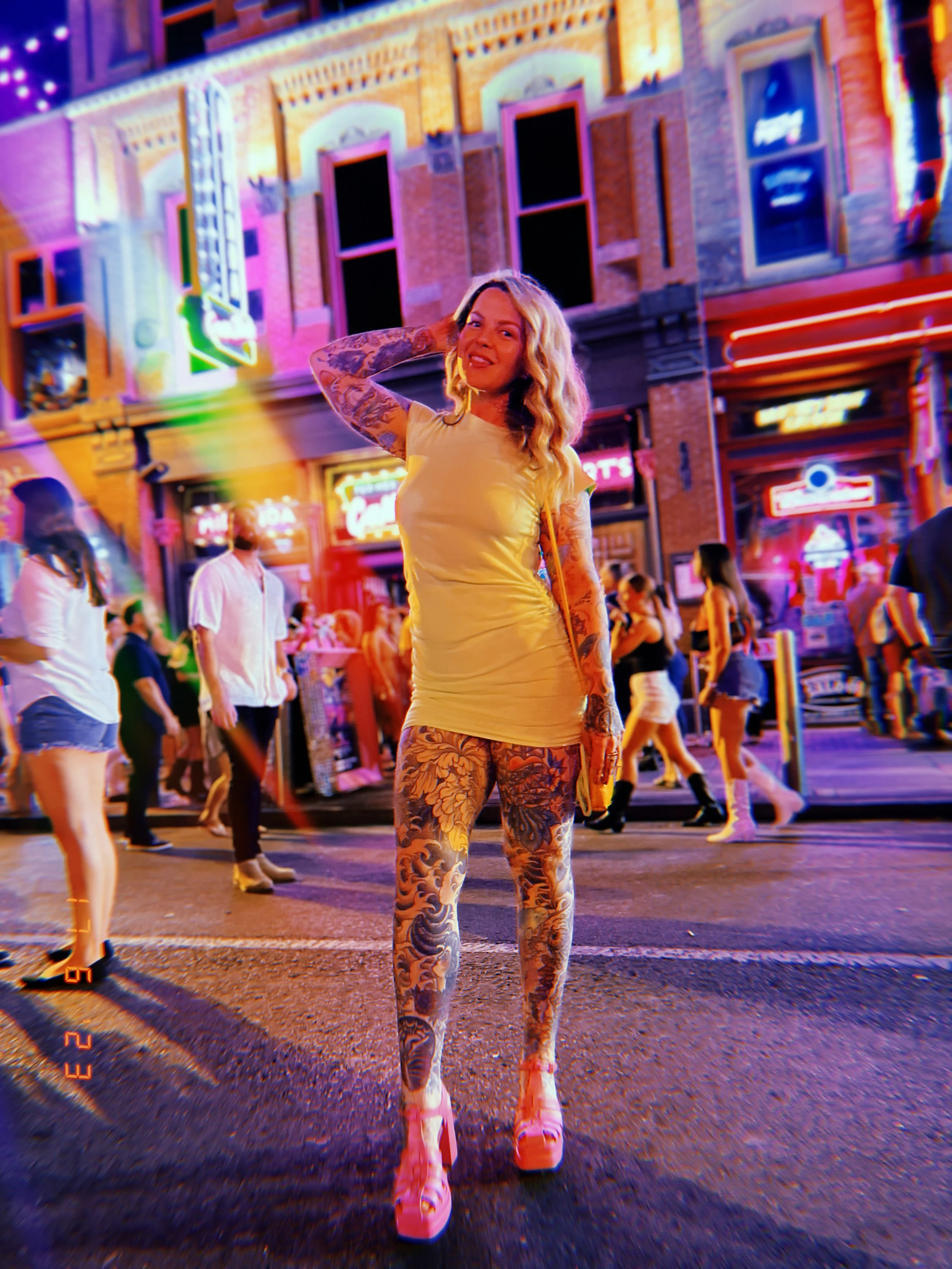 a heavily tattooed woman walks into a bar 