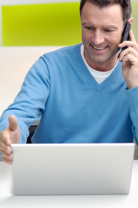 businessman casual on phone and laptop.jpg