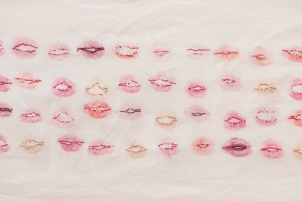 Christina Peek, The Kiss List (detail) , 2015, lipstick, cotton thread, linen, dimentions variable, photograph James Field, courtesy of Adelaide Central School of Art