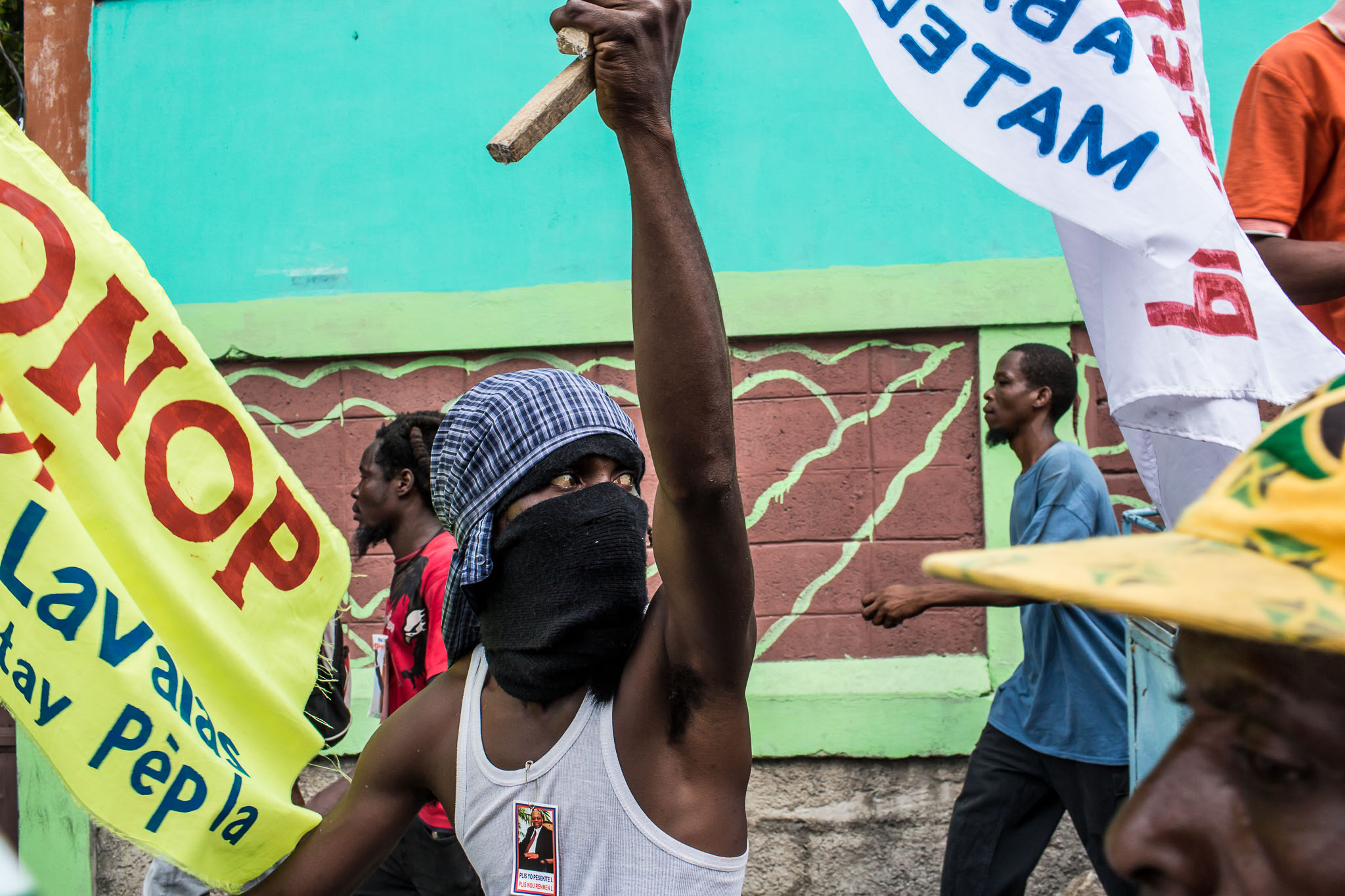  People march during an anti-government protest on Tuesday, December 16, 2014 in Port-au-Prince, Haiti. President Michel Martelly was elected in 2010 with great hope for reforms, but in the wake of slow recovery and parliamentary elections that are t