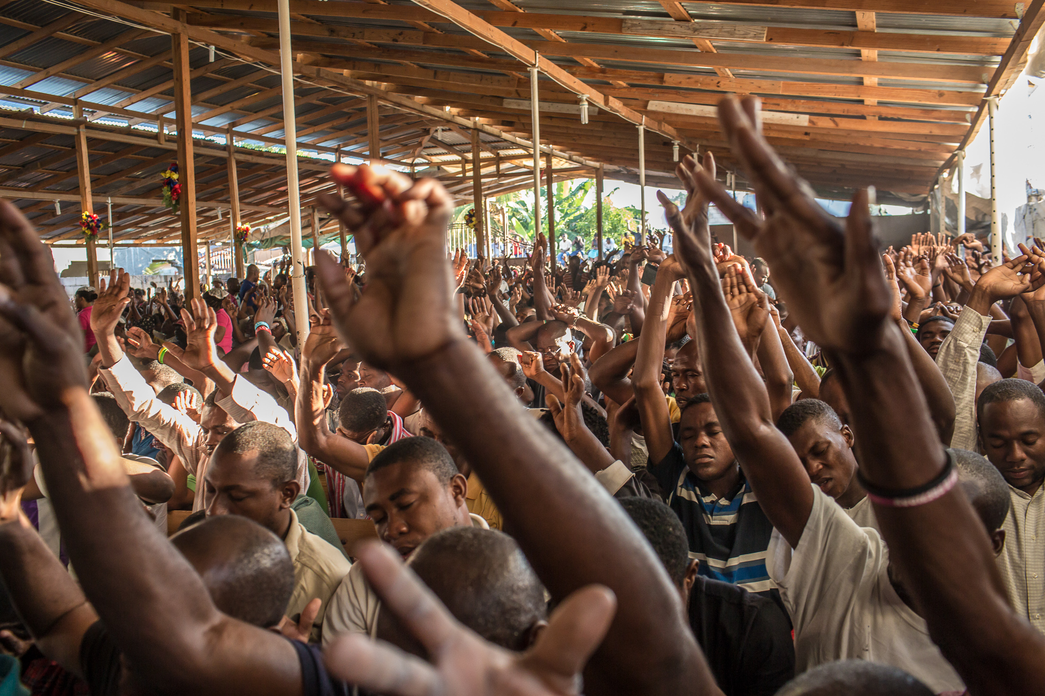  Worshipers at L'Eglise Evangelique Piscine de Bethesda, the church of televangelist Marcorel Zidor, on Saturday, December 20, 2014 in Port-au-Prince, Haiti. Pastor Zidor attracts a large audience with his emotional services and miracle medical cures