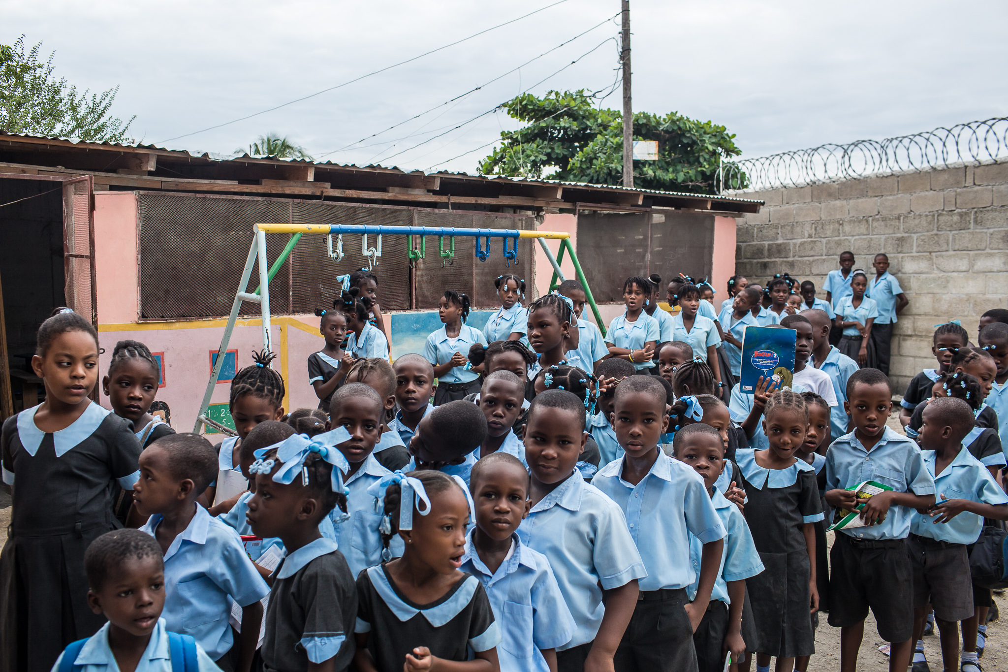  Children gather at the start of their school day on Wednesday, December 17, 2014 in Port-au-Prince, Haiti. 